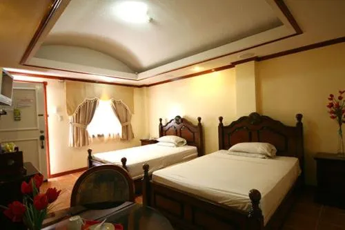 Bed in PALM TREE RESORT AND RESTAURANT