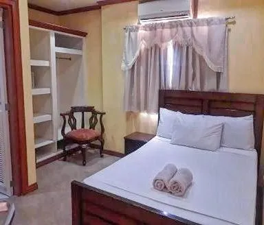 Bed in PALM TREE RESORT AND RESTAURANT