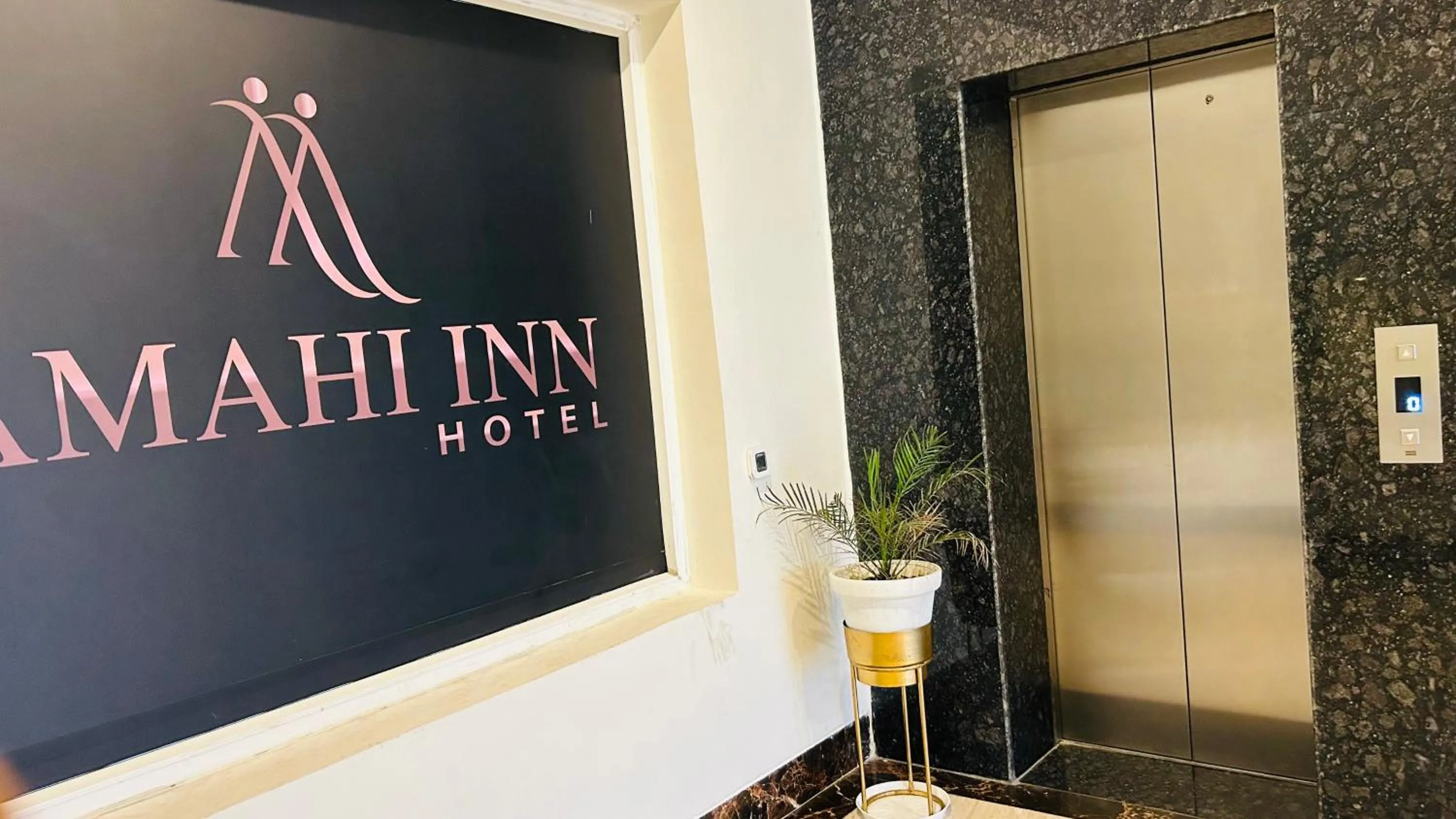 Property logo or sign in Amahi Inn I Signature Towers