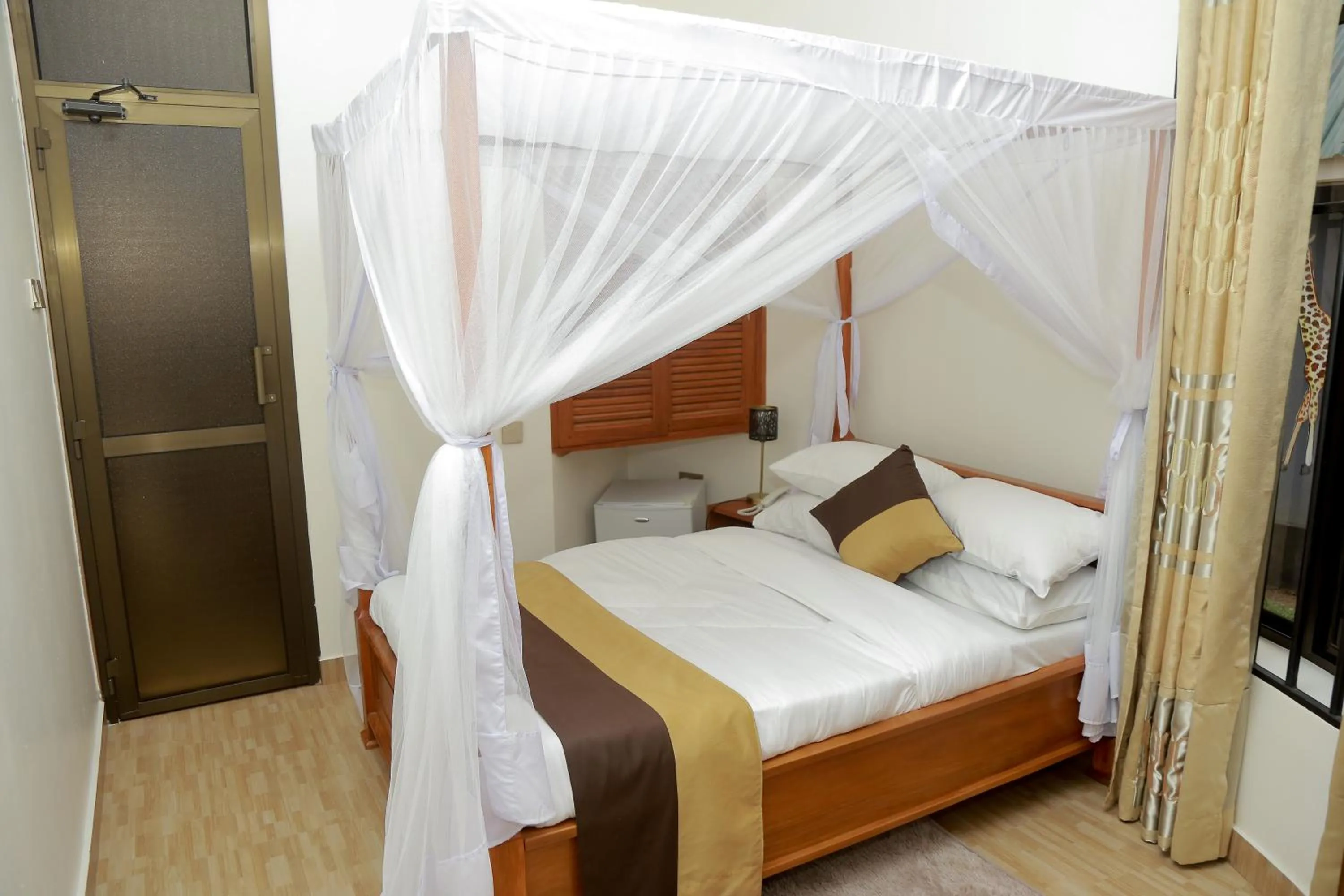 Photo of the whole room, Bed in Wademac Arusha Inn Hotel