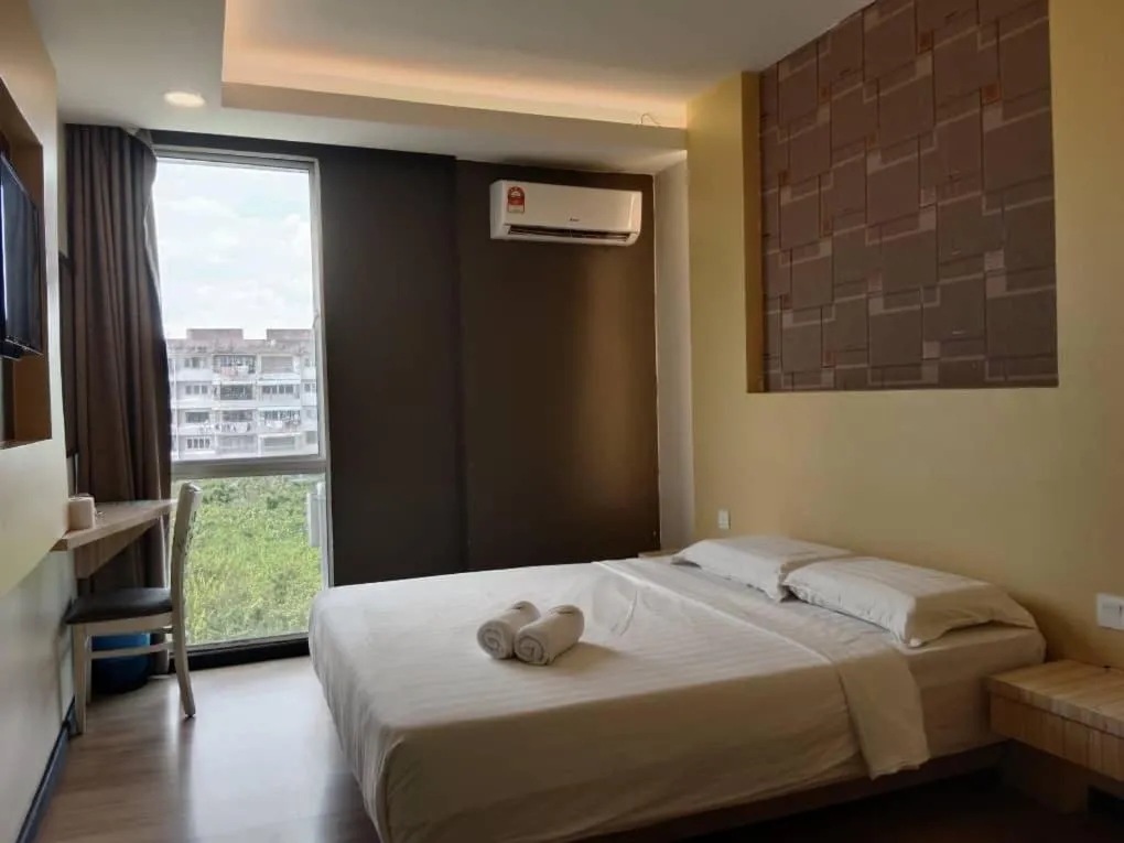 Bed in TOWERMAS HOTEL