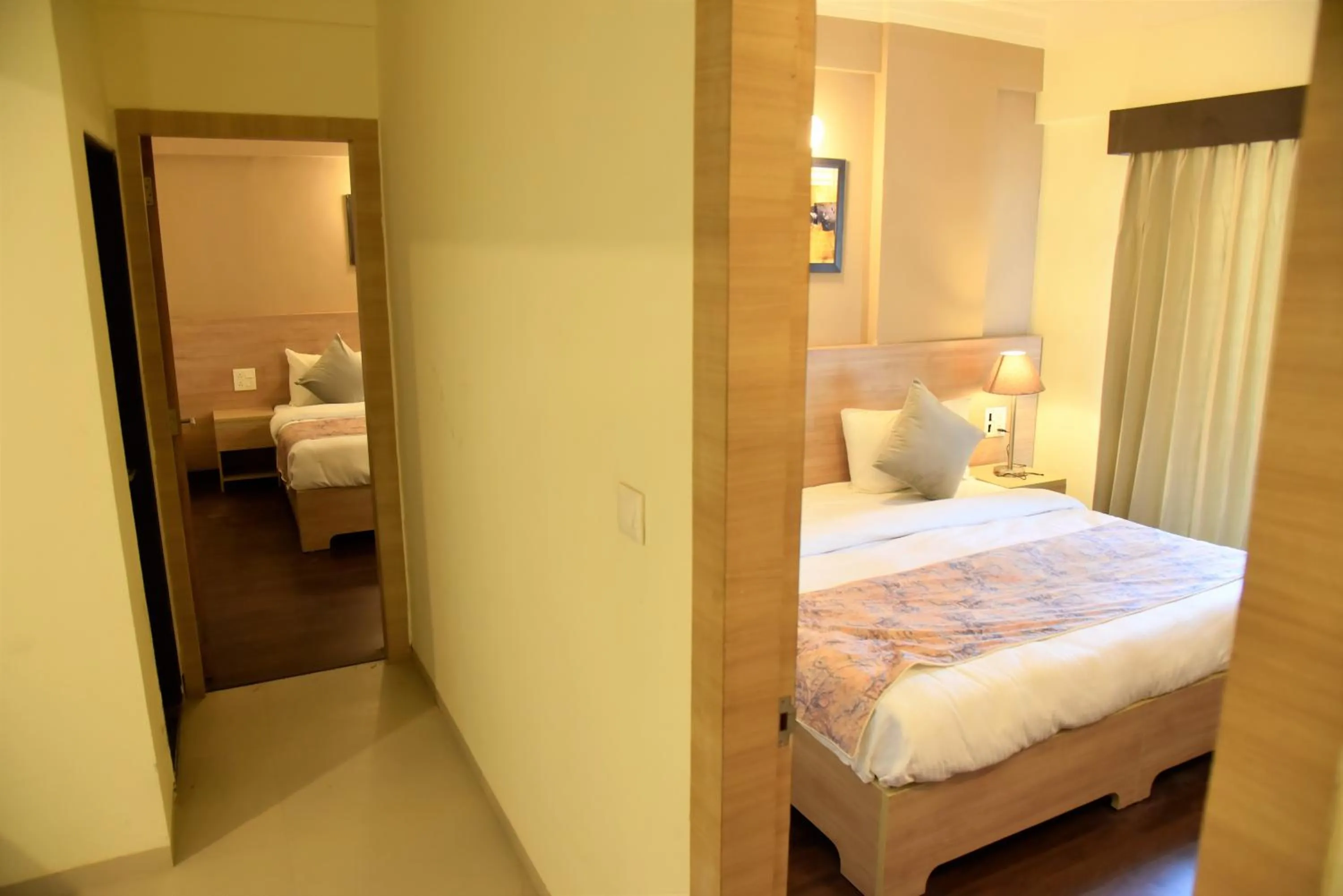 Bedroom, Bed in Starlit Suites Shirdi