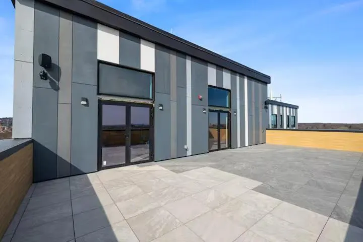 Property building in Emerald Escape, Free Parking, 2 Bath, Sleeps 8 Near American Dream and The Airport, King Bed and 2 Queen Beds, Washer and Dryer