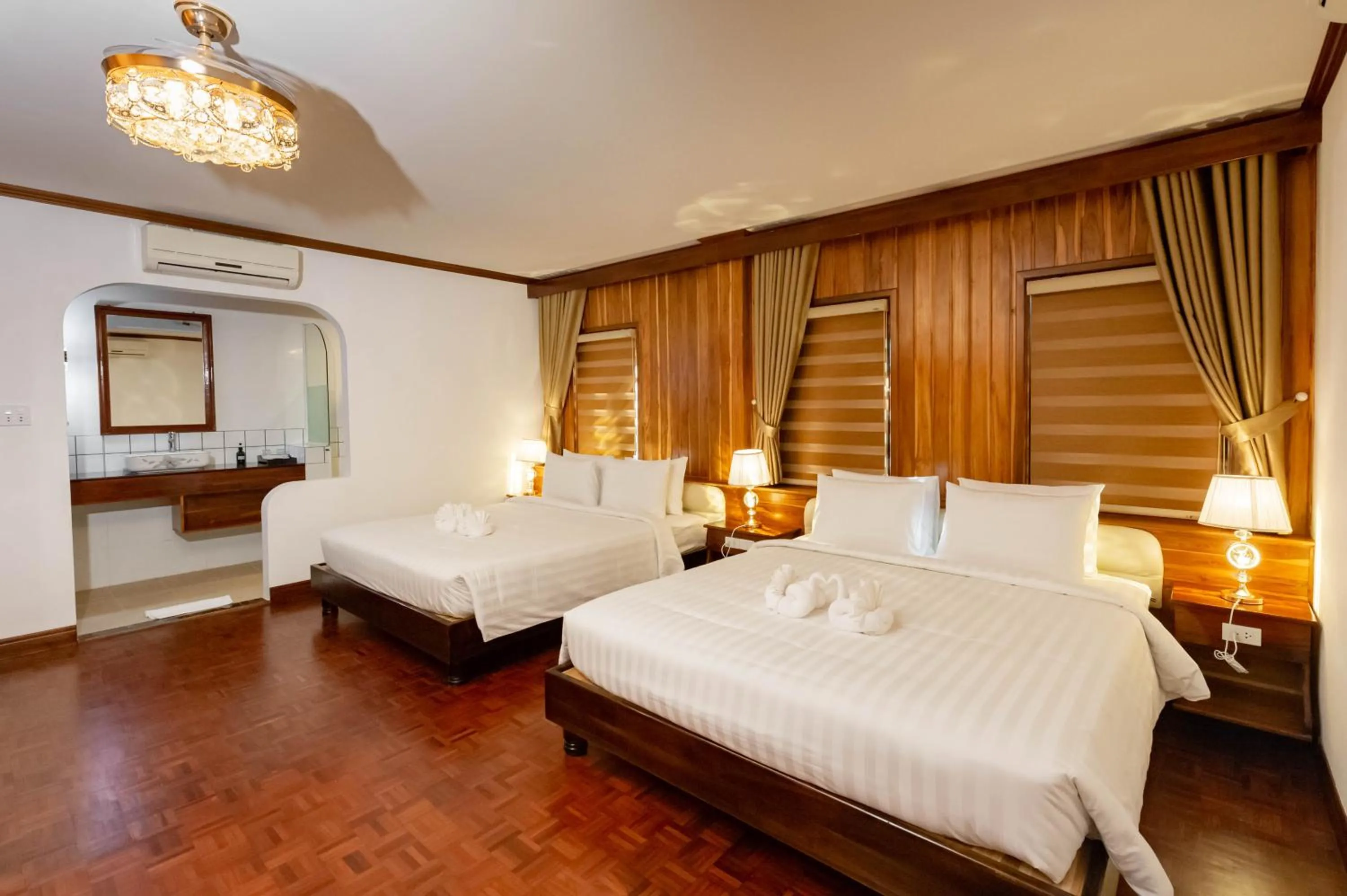 Photo of the whole room, Bed in LuangPrabang Center Hotel