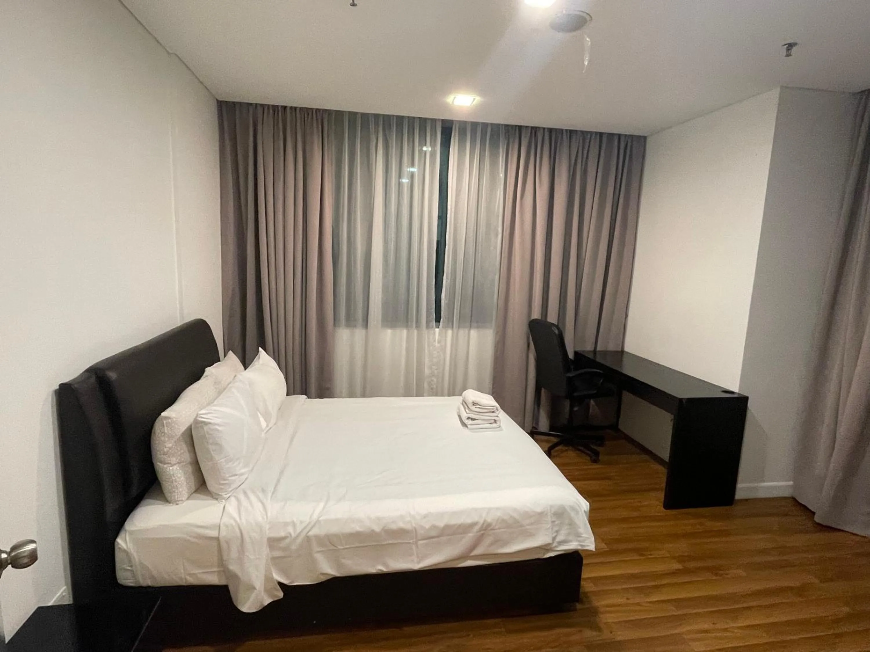 Bed in Mercu Summer Suite KLCC by Kuminshu