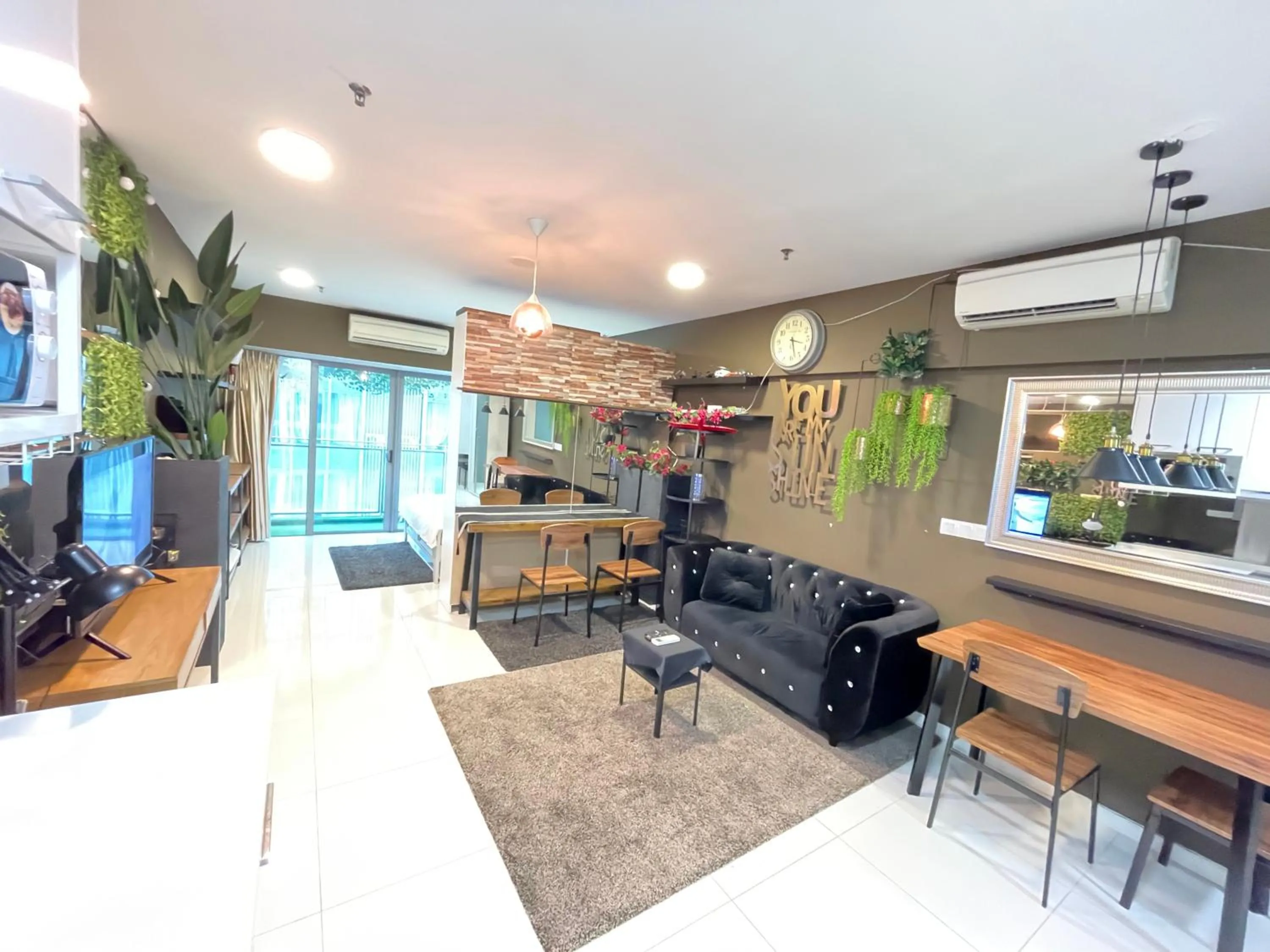 Communal lounge/ TV room in Mercu Summer Suite KLCC by Kuminshu