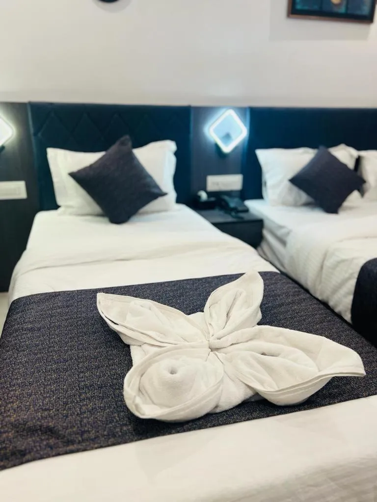 Bed in Hotel Larmont Luxury