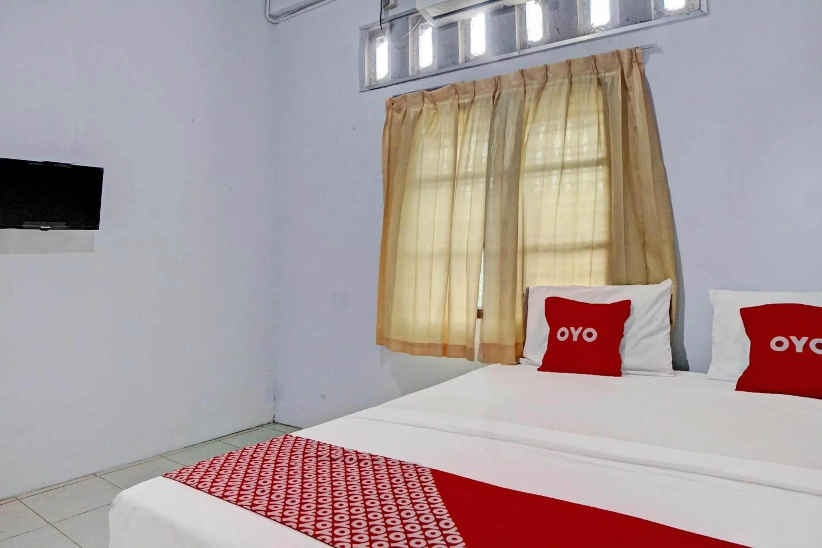 Bedroom in Hotel O Vania Guest HouseNearRSUP H Adam Malik