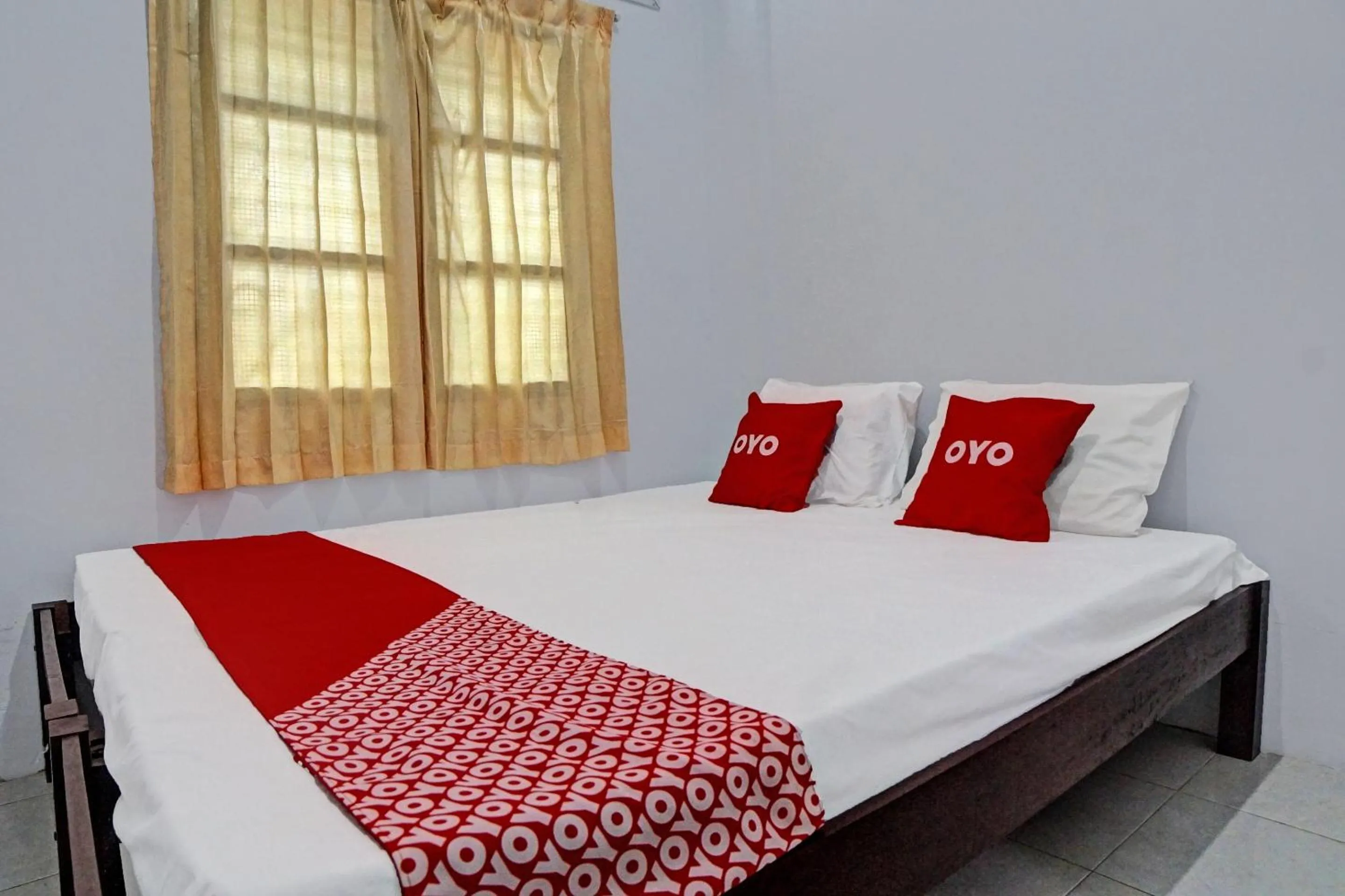 Bedroom in Hotel O Vania Guest HouseNearRSUP H Adam Malik