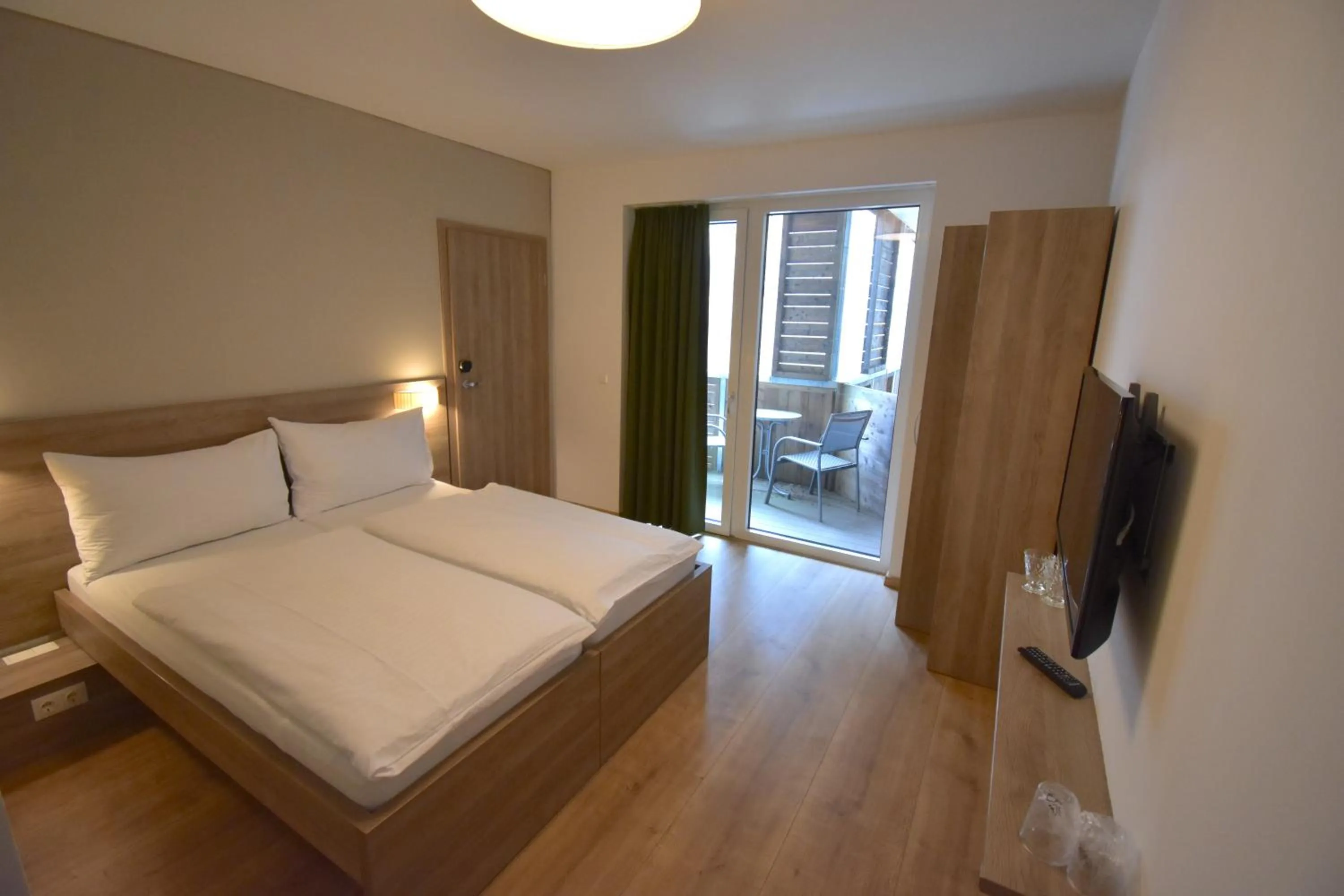 Photo of the whole room, Bed in Sporthotel Zederhaus im Lungau