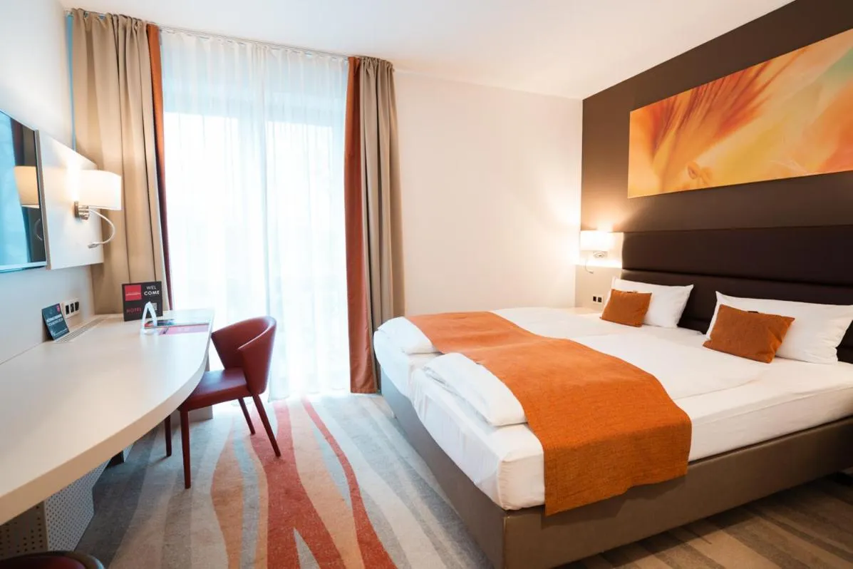 Bed in Hotel Kapuzinerhof