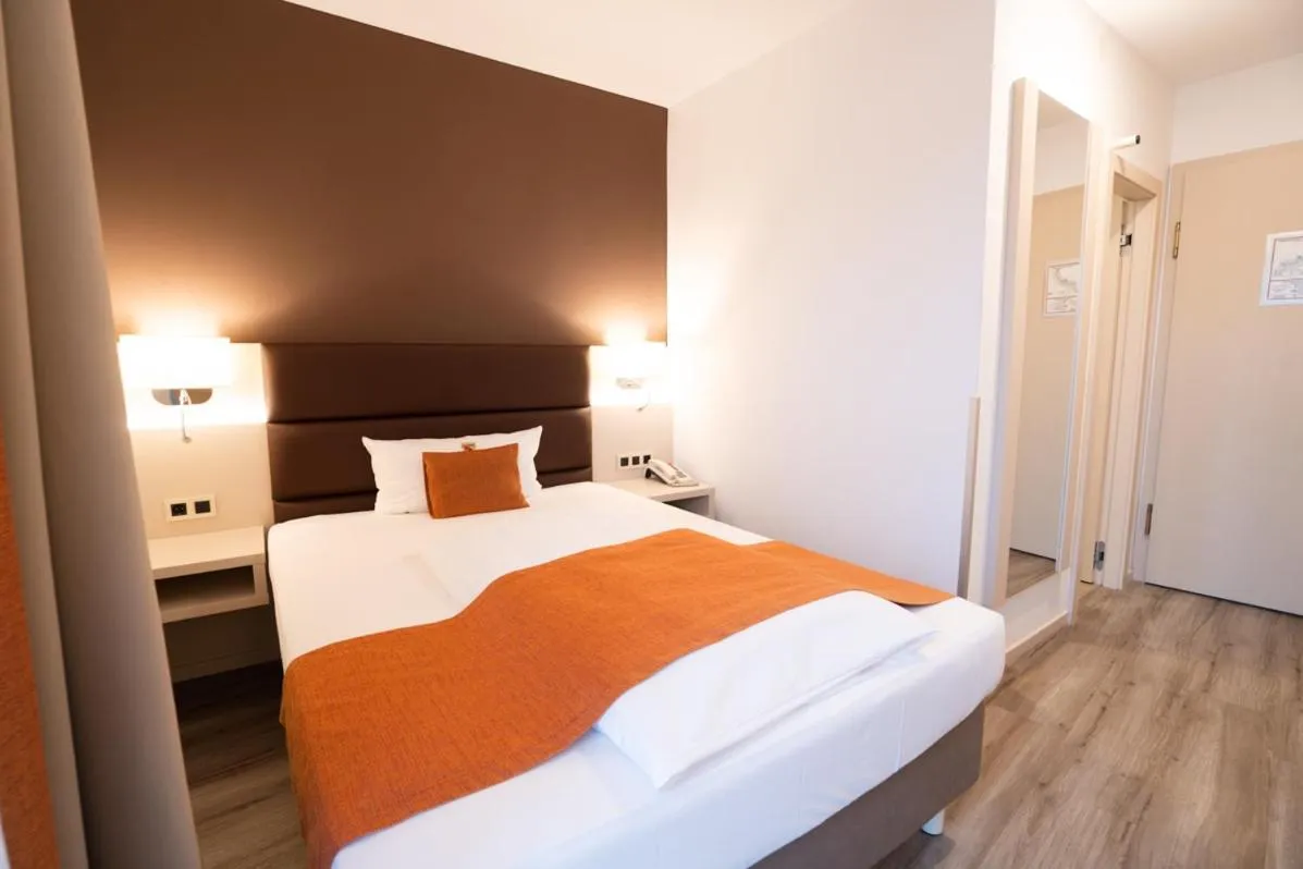 Bed in Hotel Kapuzinerhof