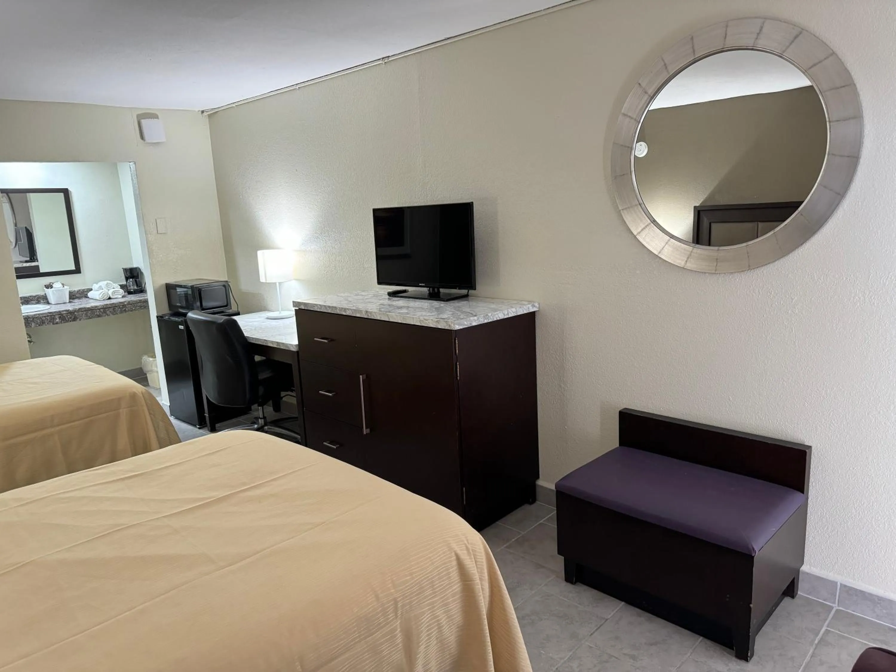 Bed in River Palm Hotel