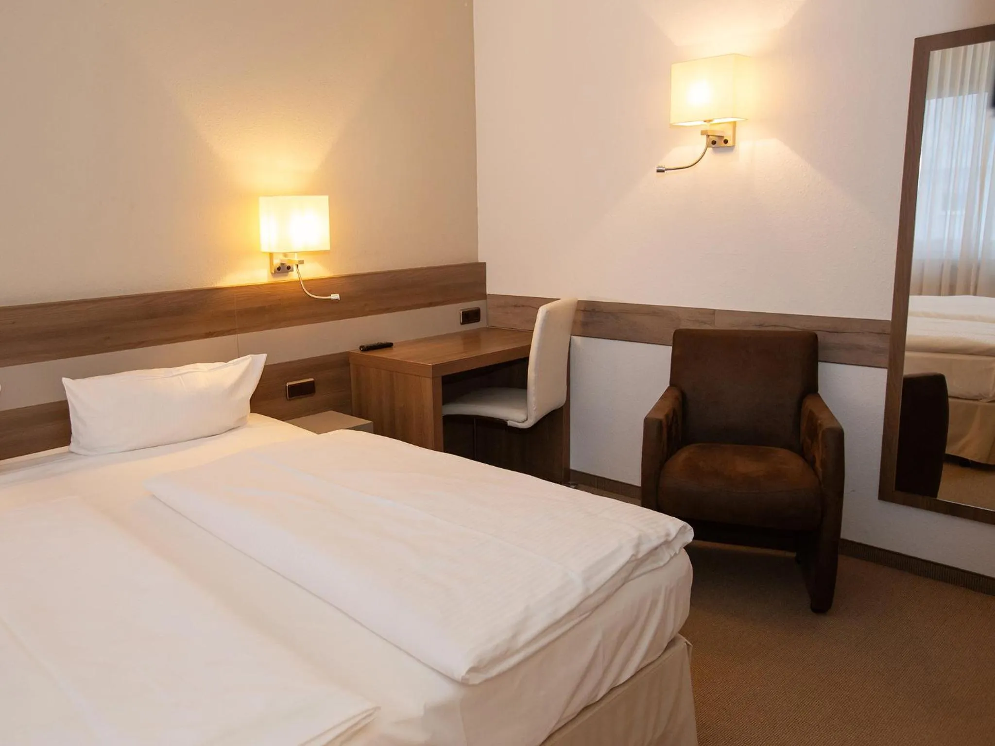 Photo of the whole room, Bed in DORMERO Hotel Greifswald