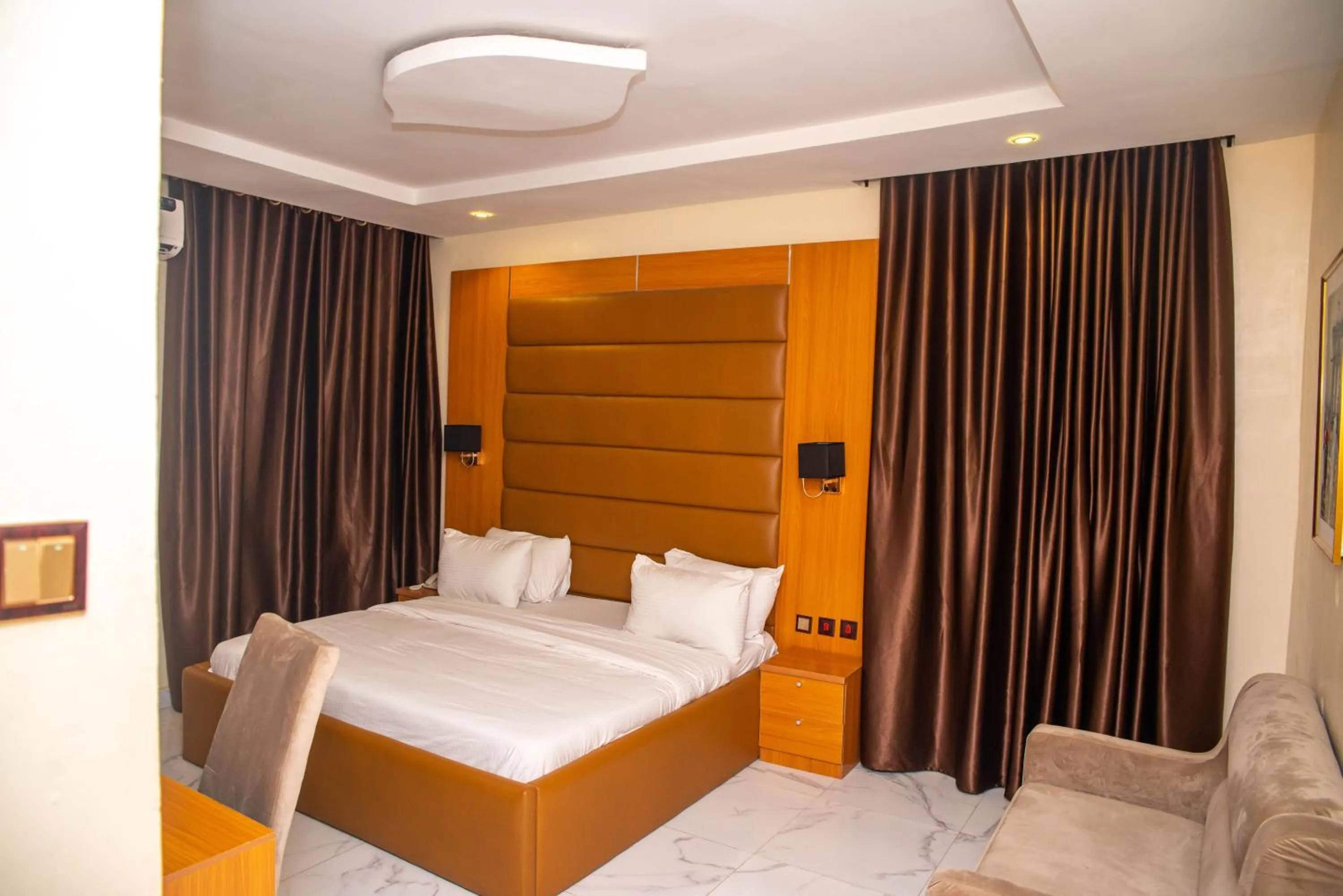 Bed in Buddiez Hotel & Resort