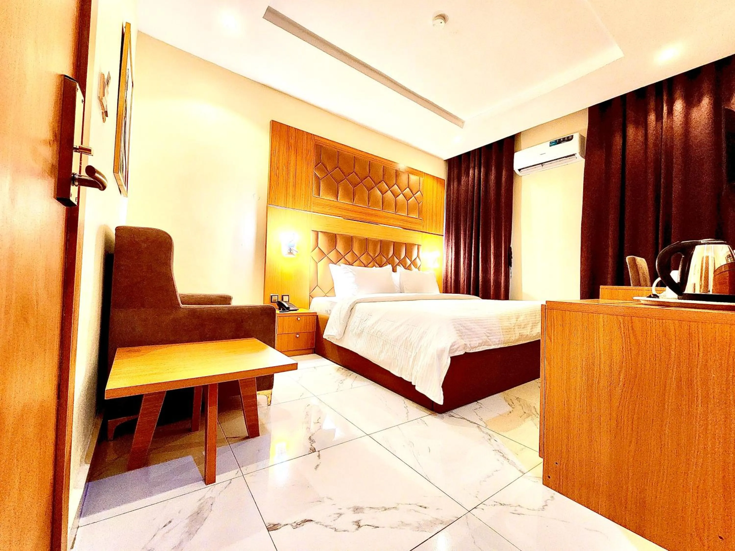 Bed in Buddiez Hotel & Resort