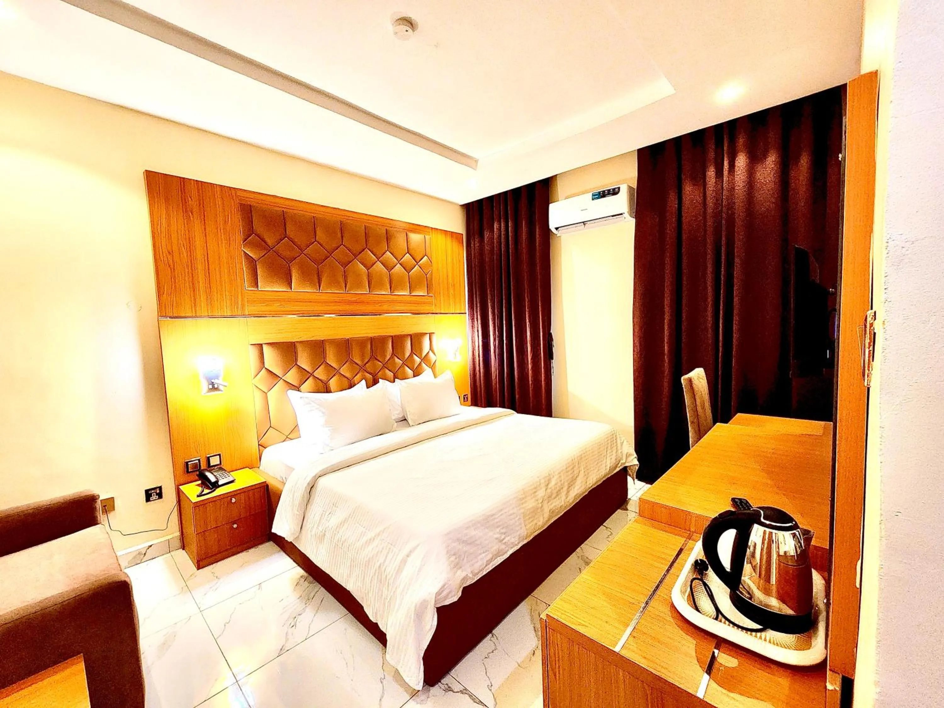 Bed in Buddiez Hotel & Resort