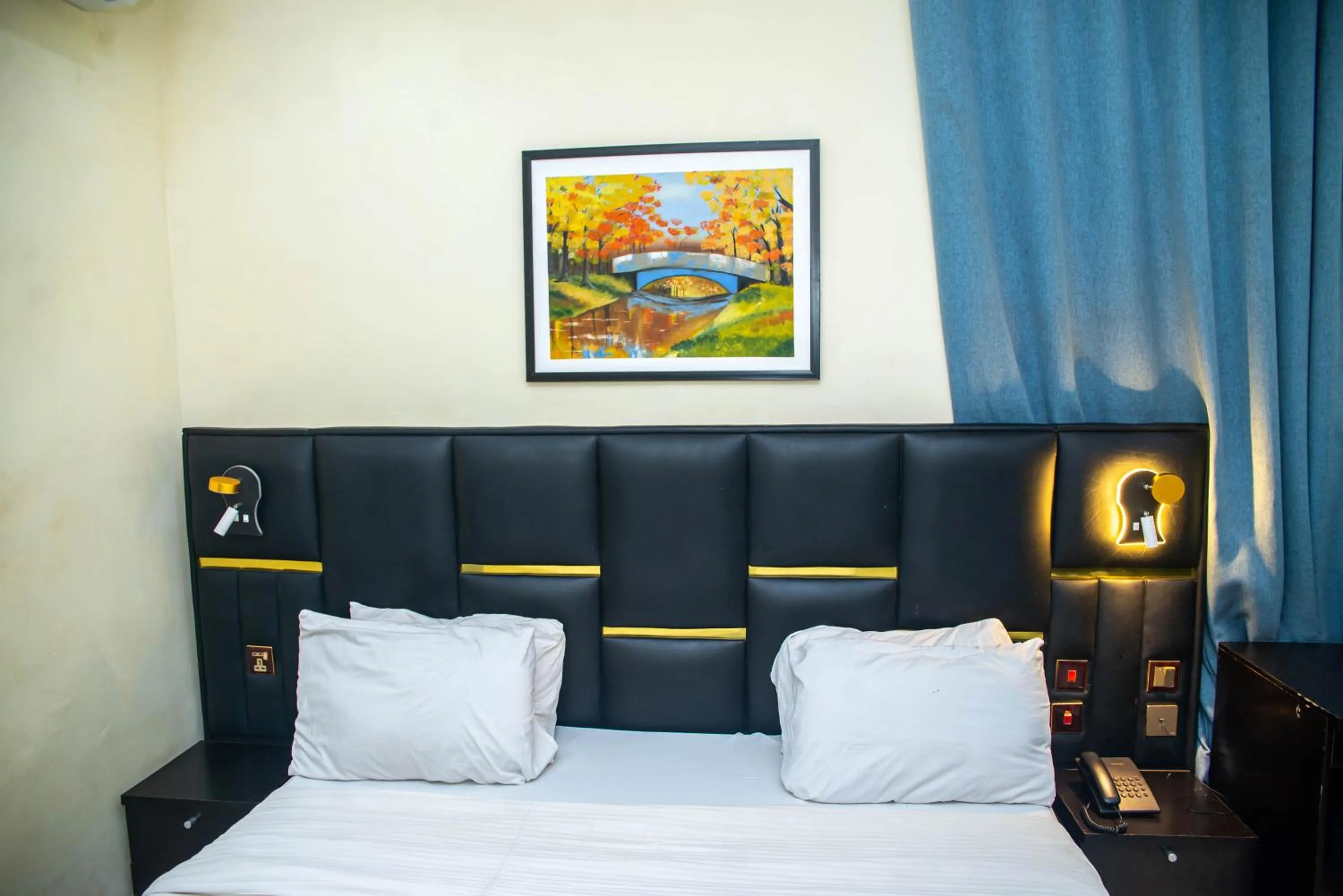 Bed in Buddiez Hotel & Resort