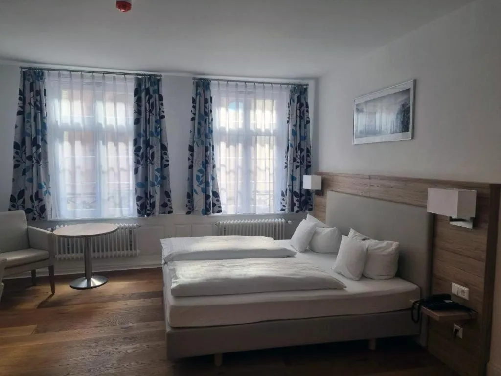 Seating area, Bed in Hotel Perkeo