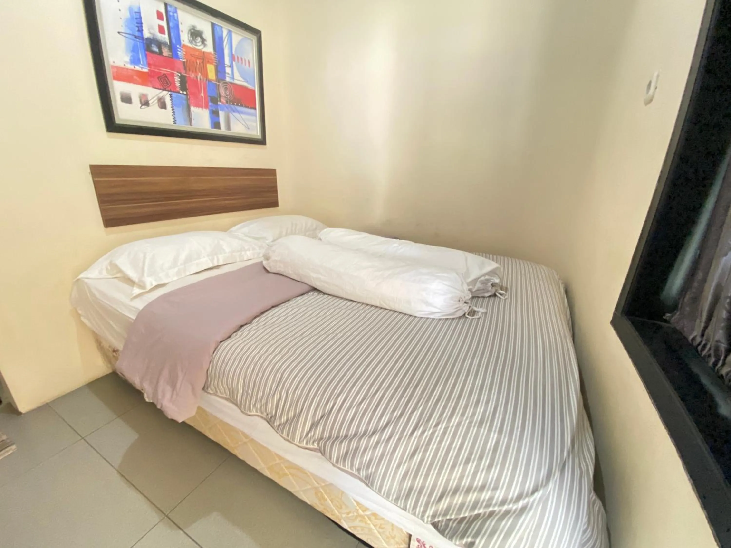 Bedroom in De Homestay Mitra RedDoorz Bitung