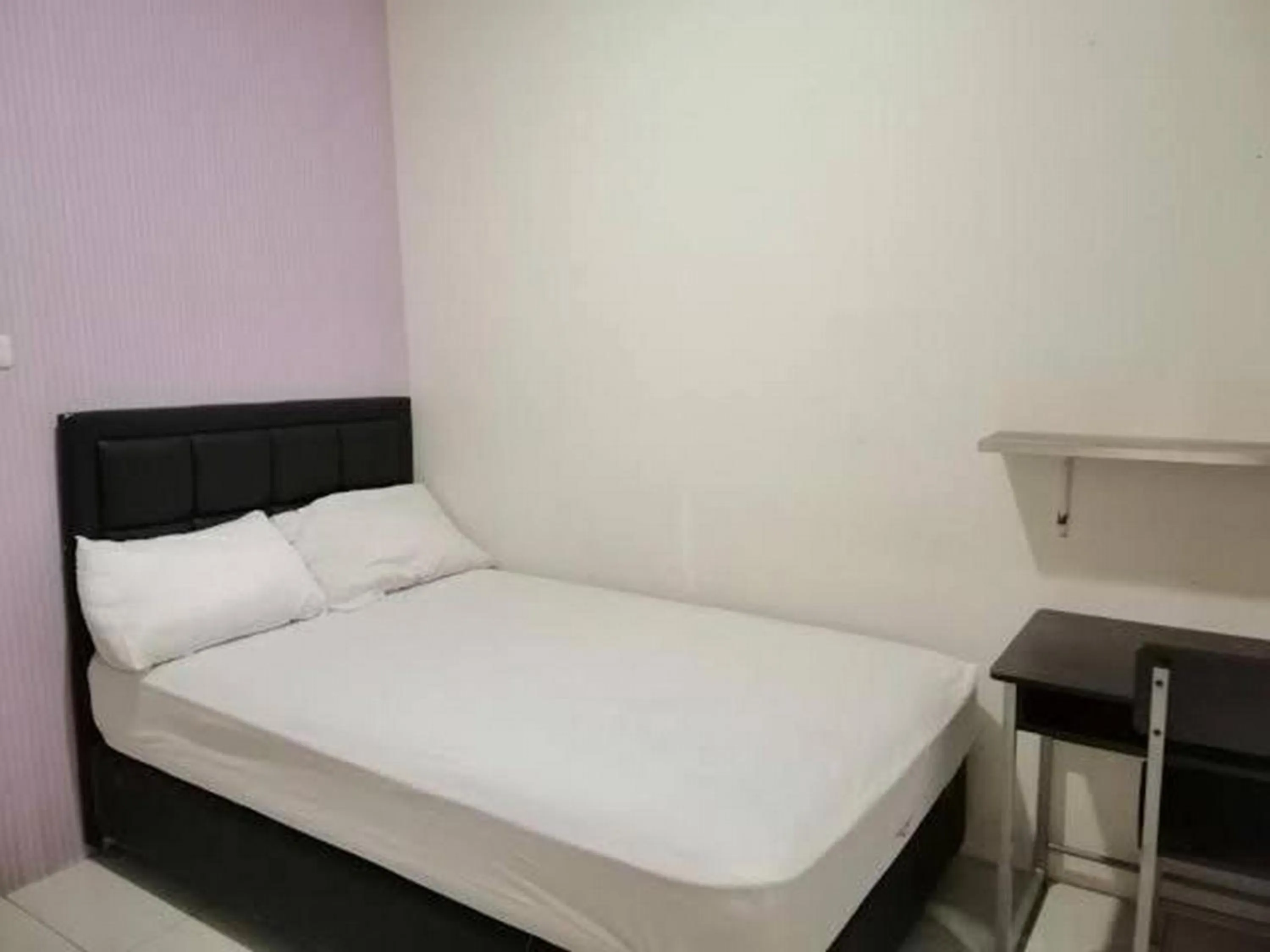 Bedroom in De Homestay Mitra RedDoorz Bitung