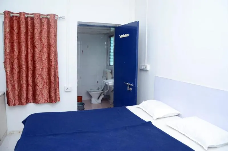 Bed in Hotel Sairam Lodge