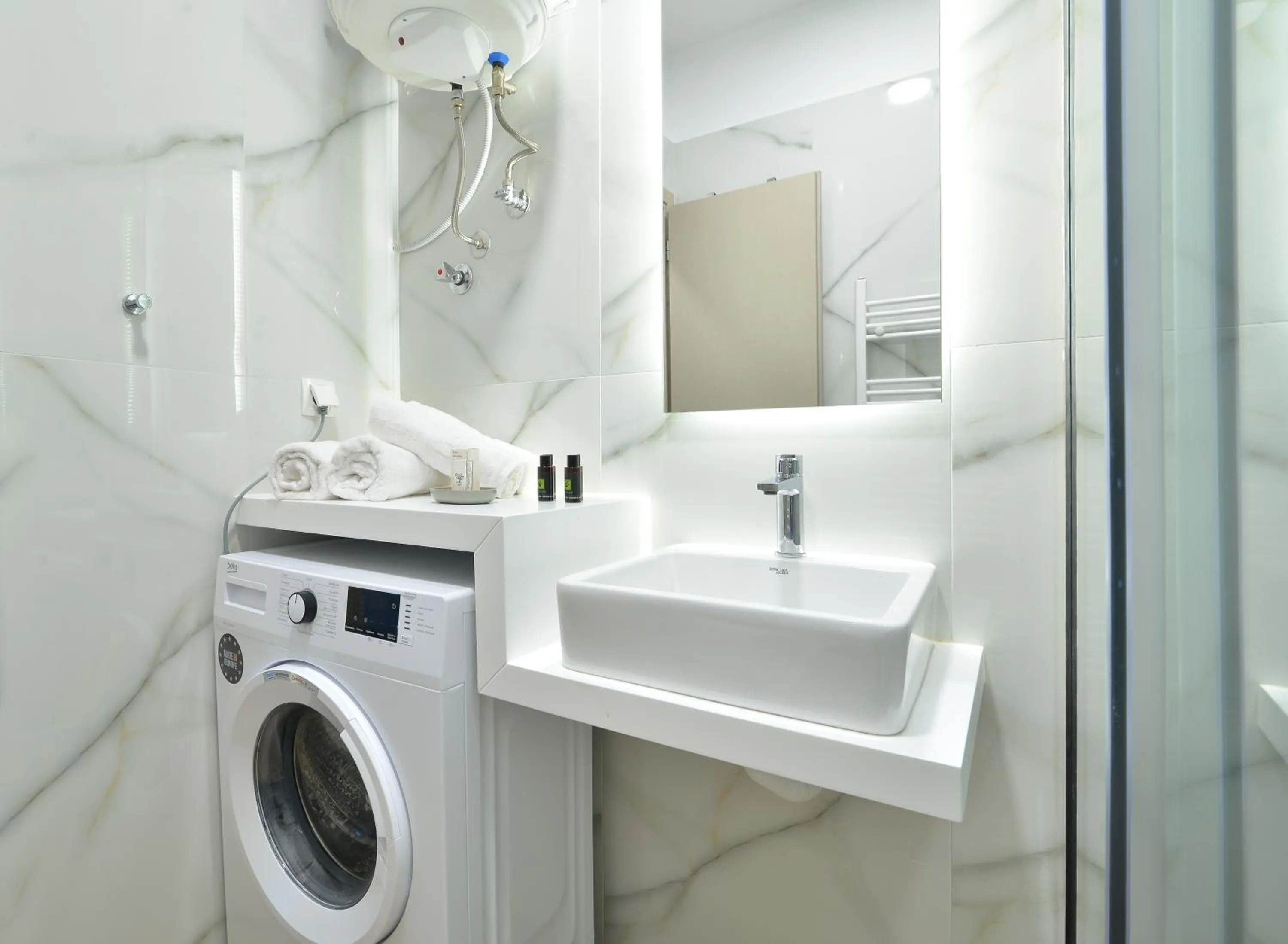 washing machine in Niel Holiday Apartments, Panel Hospitality Homes & Villas