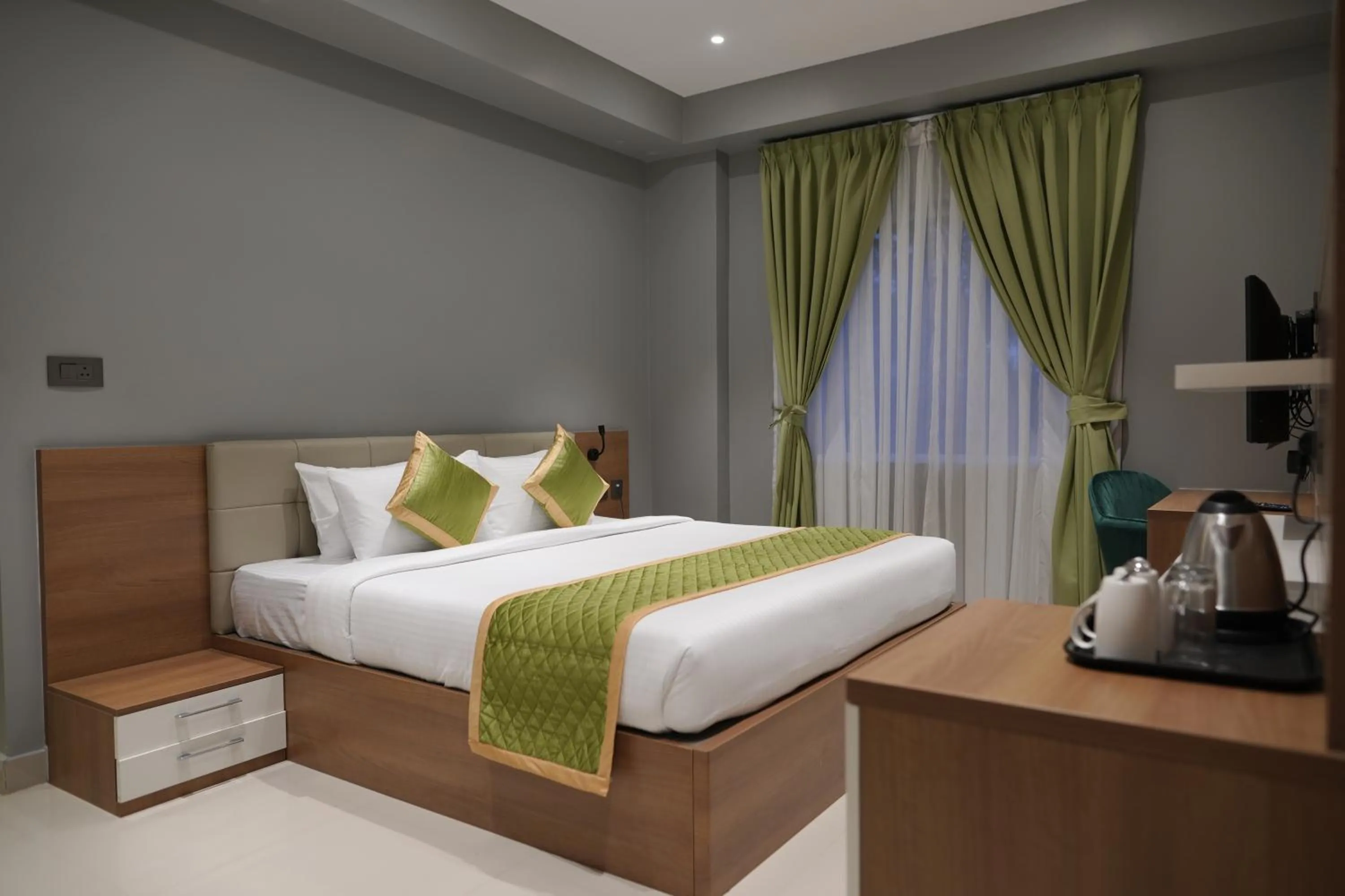 Bed in Hotel Grand Alleppey