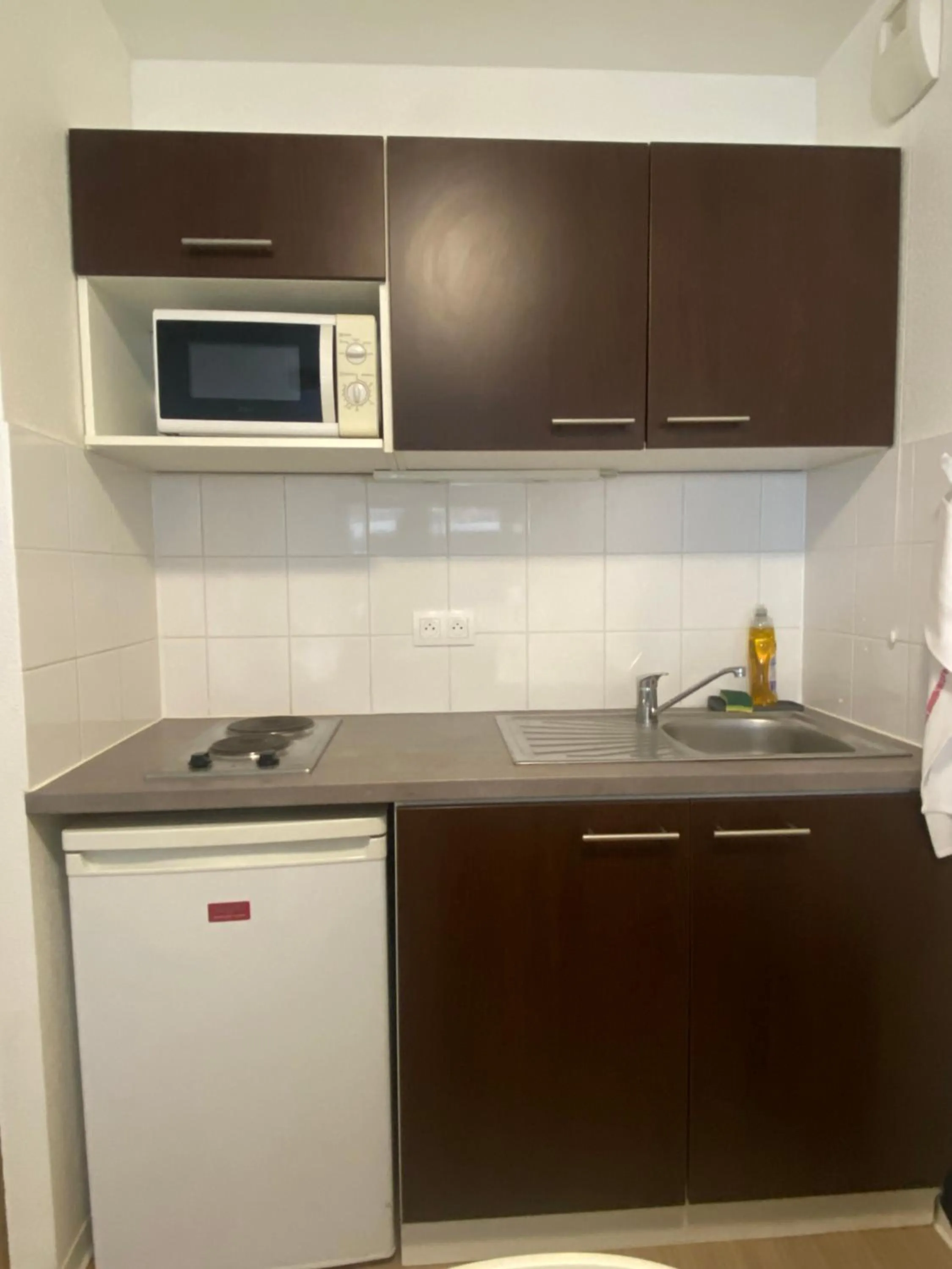 Kitchen or kitchenette in Apparteo Strasbourg