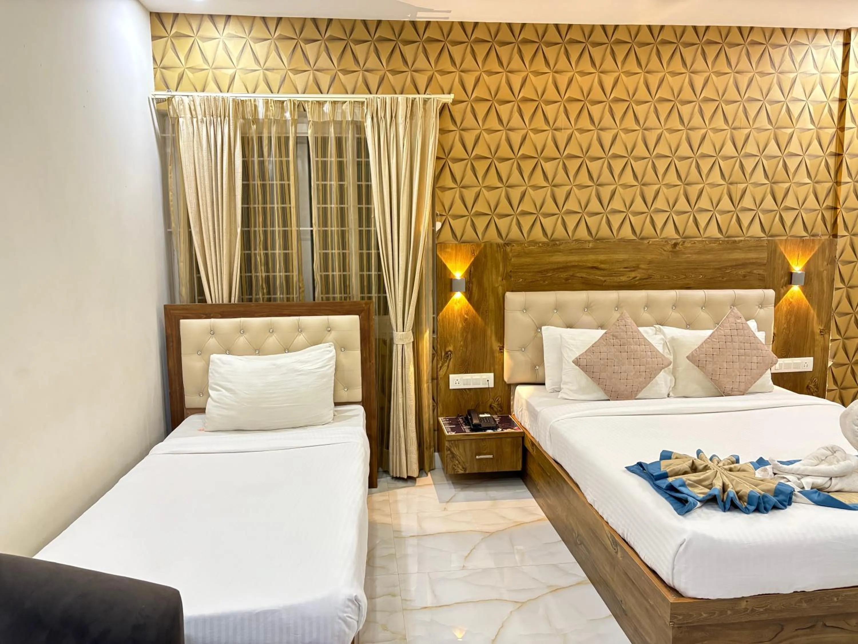 Bed in Spectra Hotel Bangalore Airport