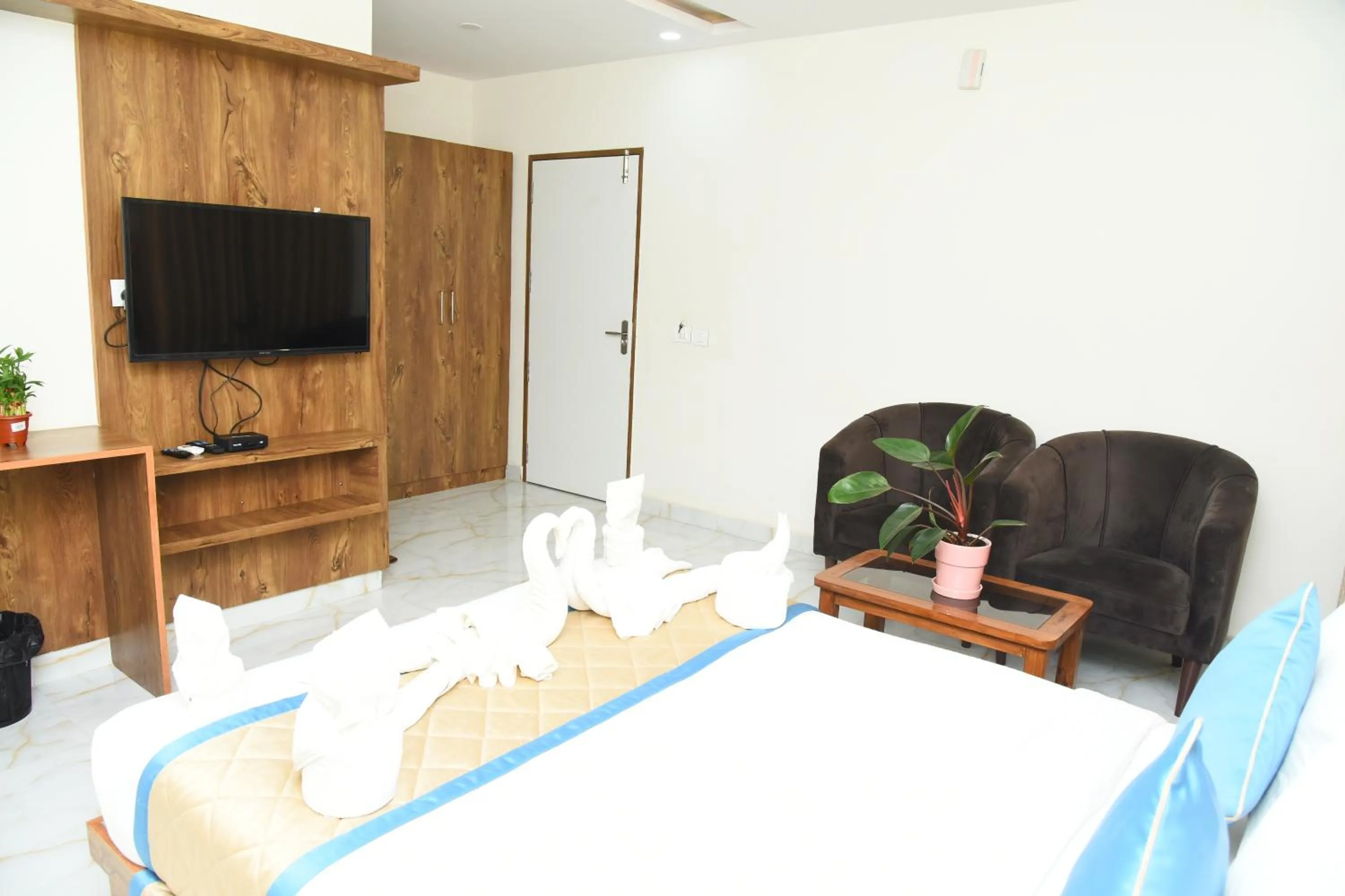 Seating area, Bed in Spectra Hotel Bangalore Airport