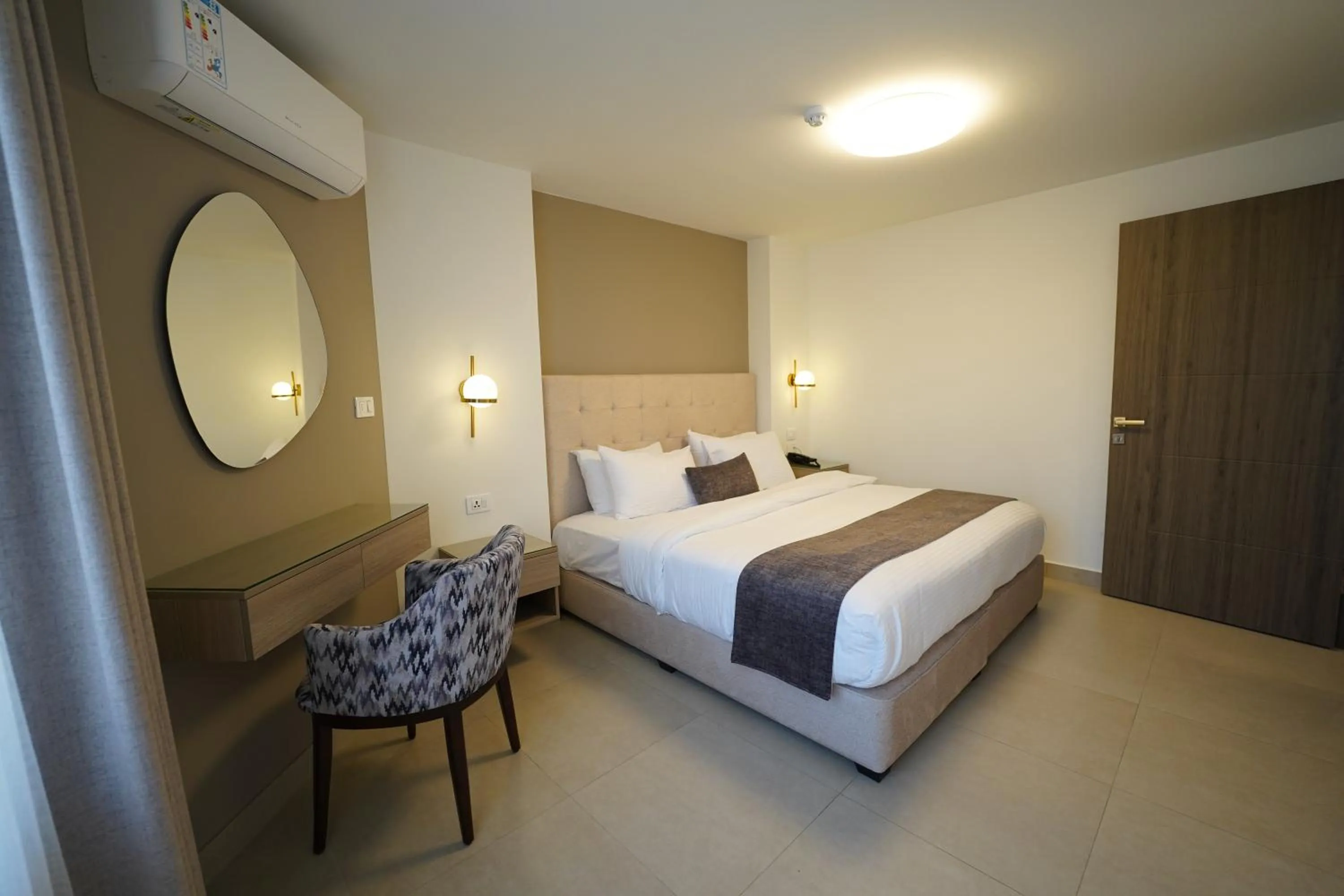 Bed in Red Carpet Hotel & Suites