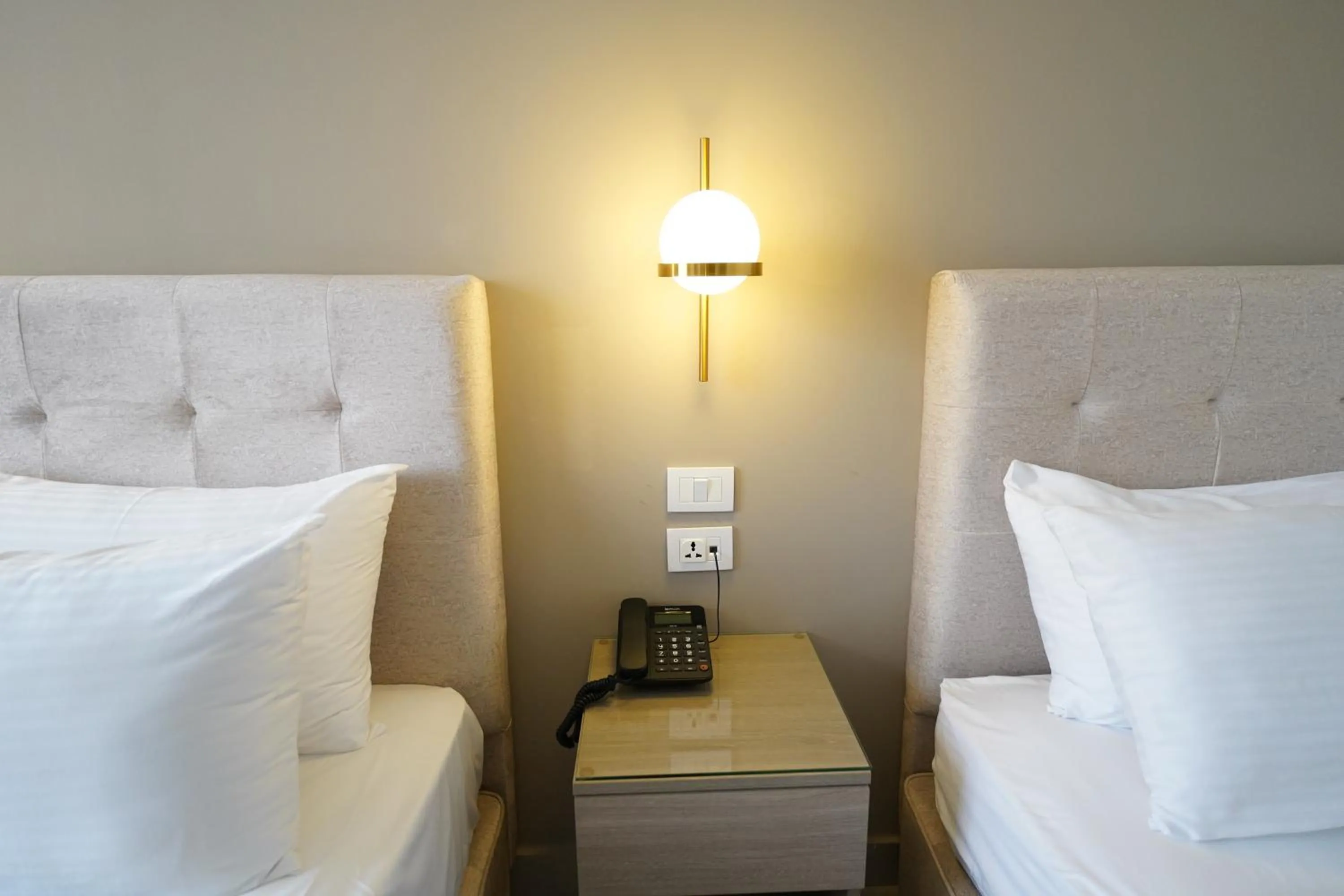 Bed in Red Carpet Hotel & Suites