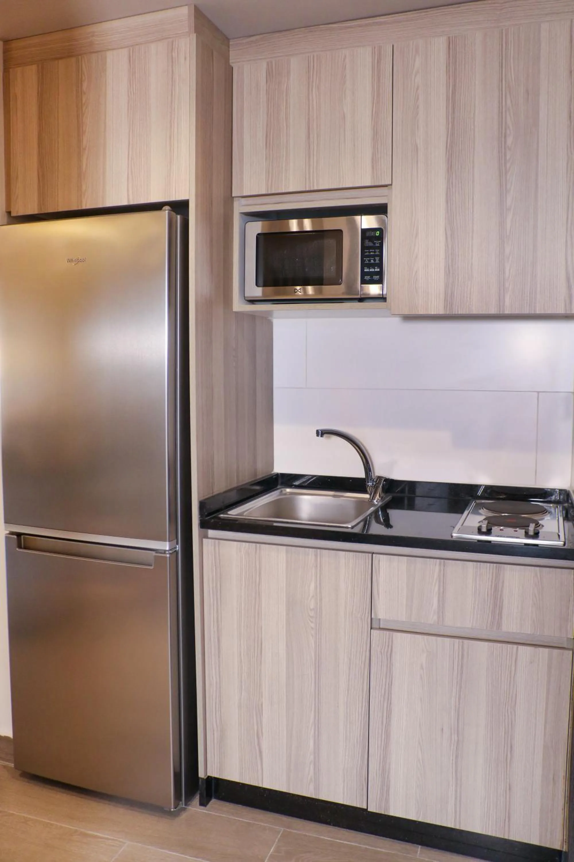 Kitchen or kitchenette in Red Carpet Hotel & Suites