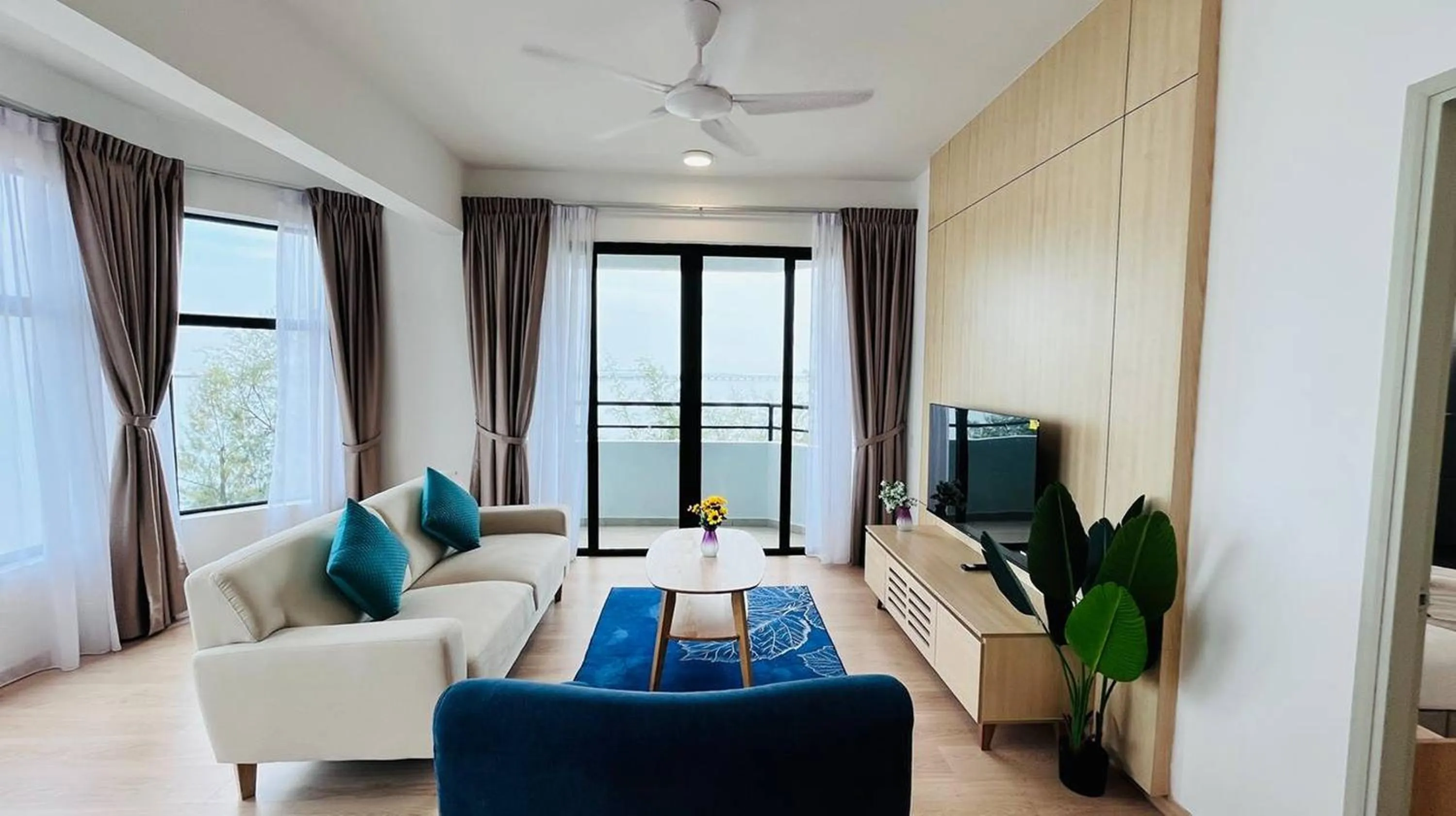 Living room, Bed in Mutiara Melaka Beach Paradise by Glex