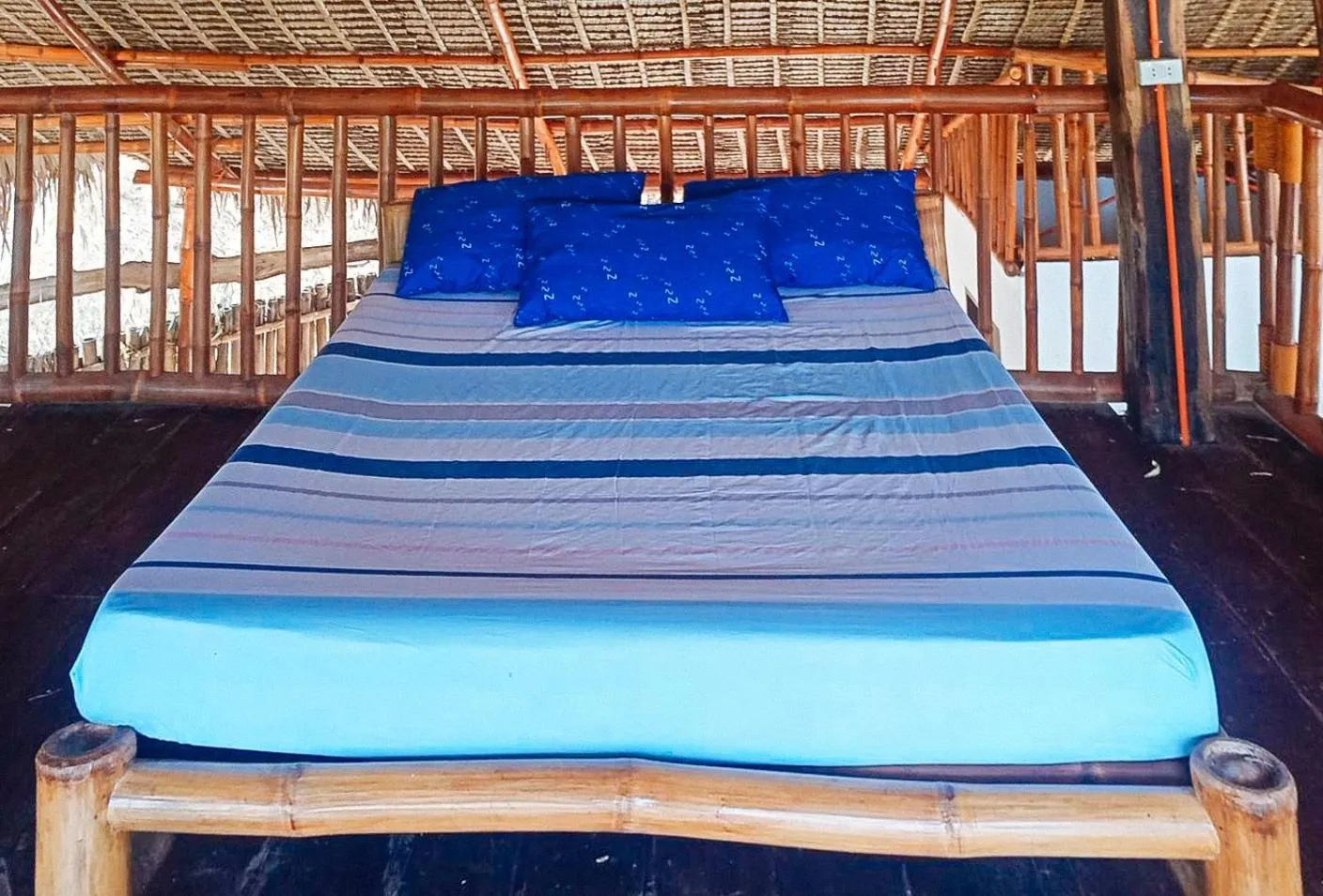 Bed in RedDoorz @ Ham Jam Inn Resort