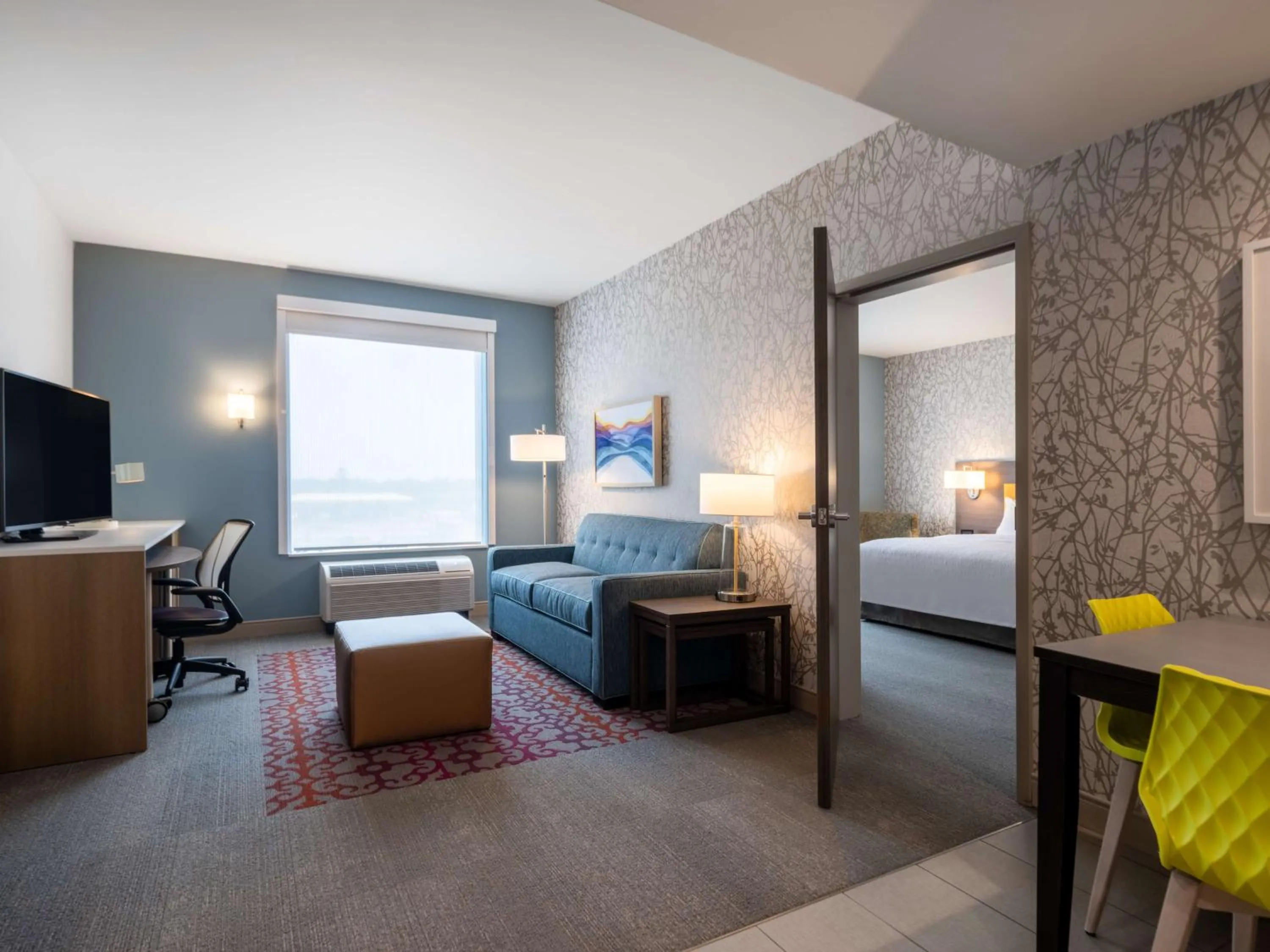 Living room, Bed in Home2 Suites By Hilton Santa Rosa Beach