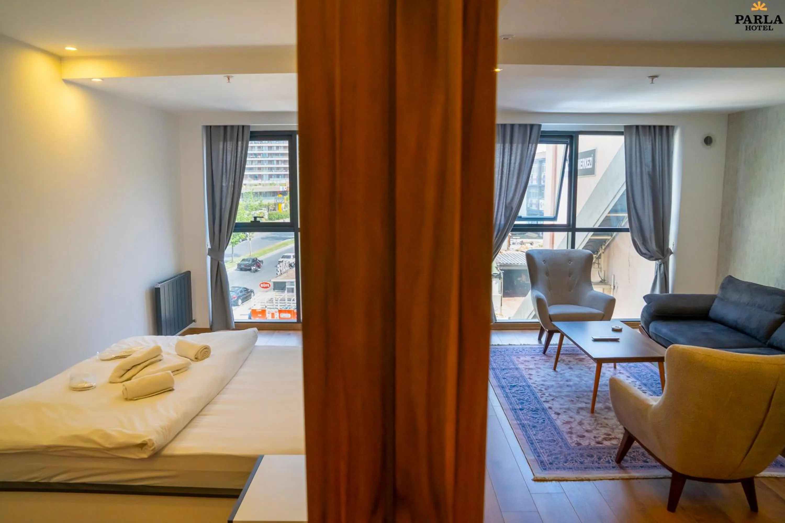 Bed in Parla Suite Hotel