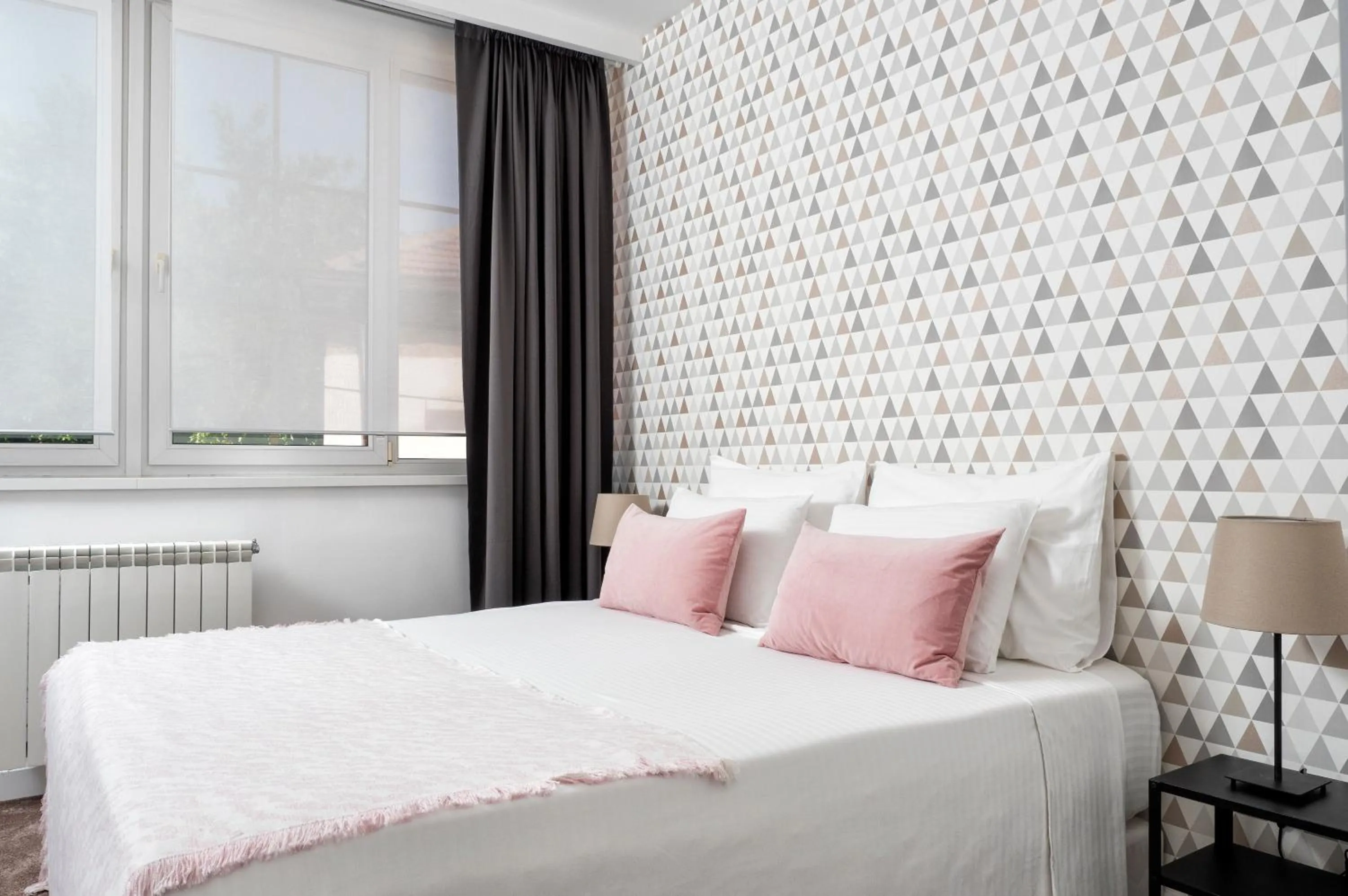 Bed in Garni Hotel Le Petit Piaf