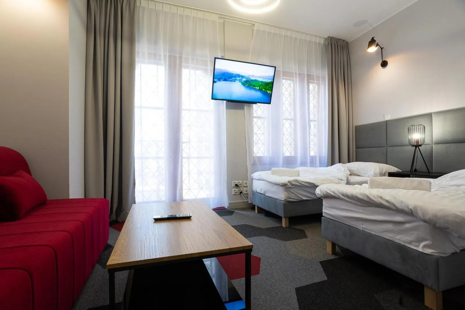 Communal lounge/ TV room, Bed in Moon Apartments Gdańsk