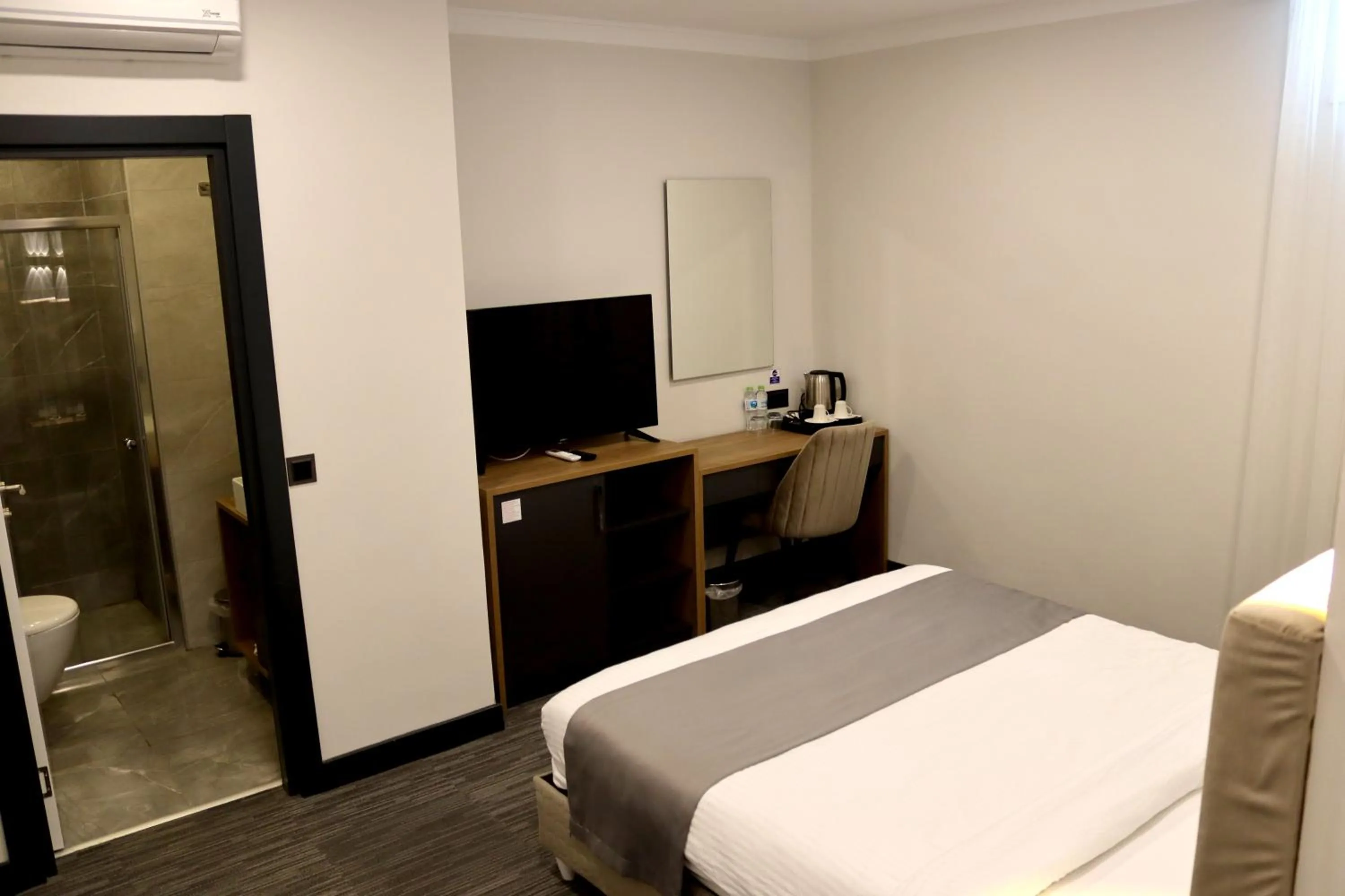 Seating area, Bed in HOME PLUS Hotel