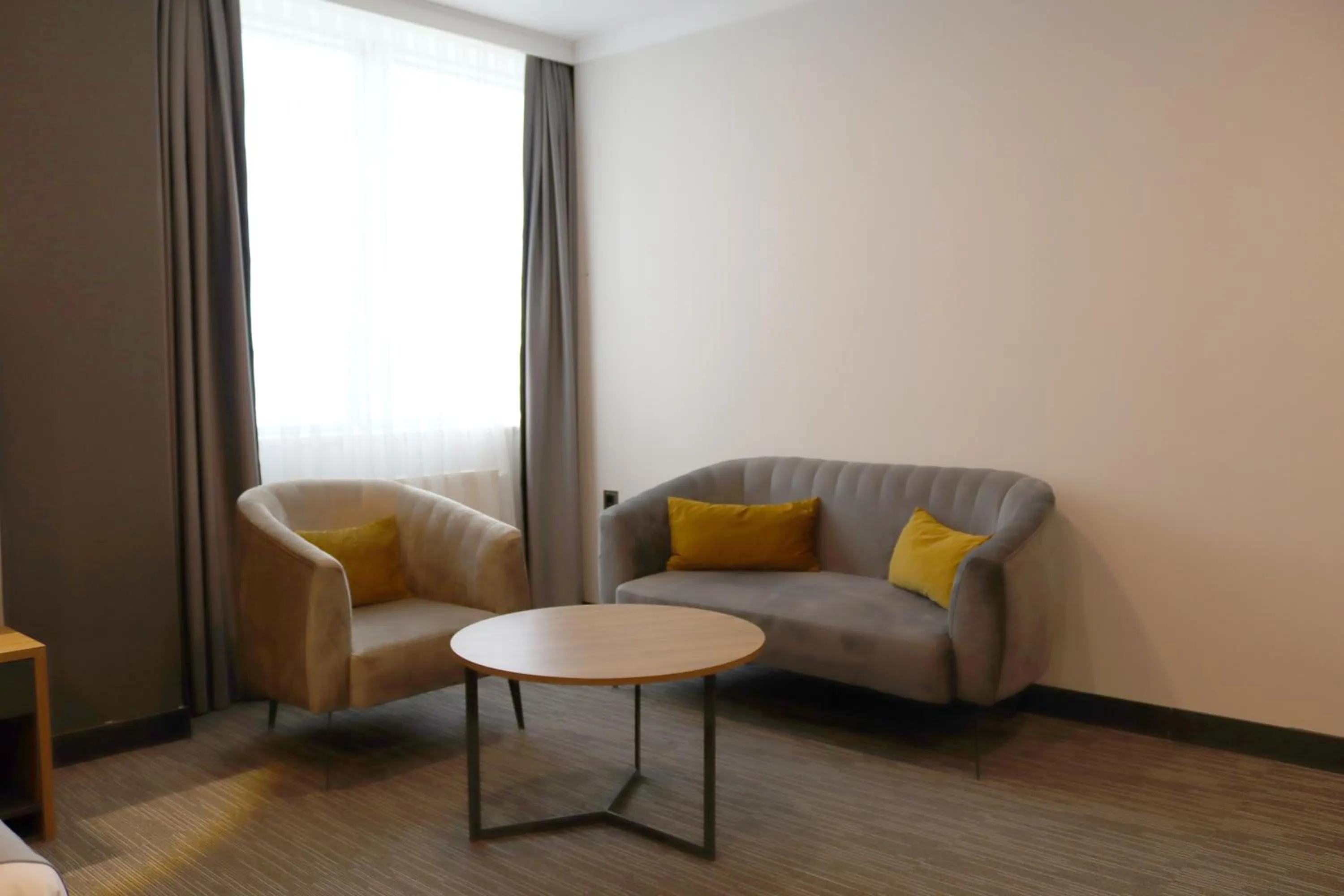 Seating area in HOME PLUS Hotel