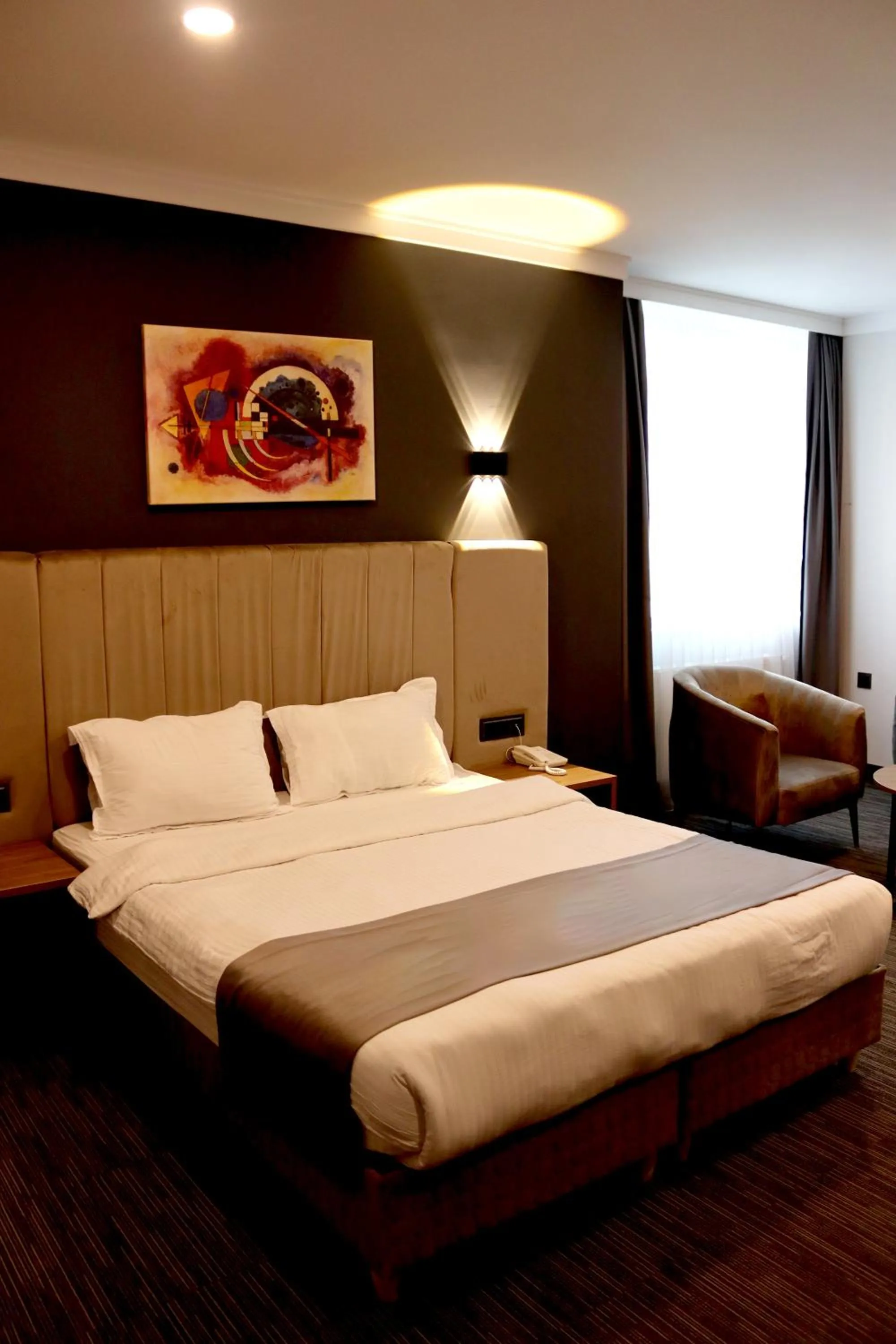 Bed in HOME PLUS Hotel