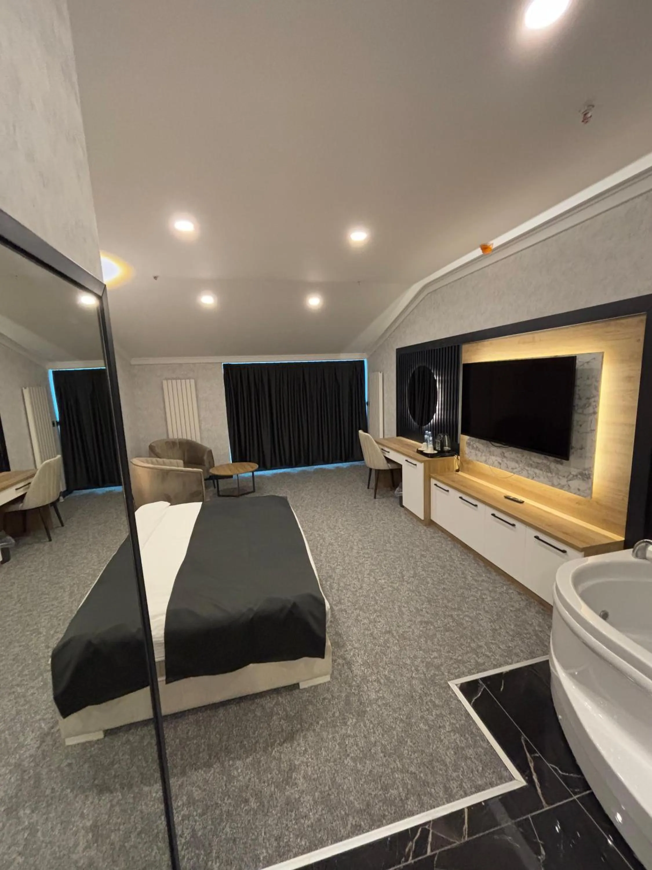 Bedroom in HOME PLUS Hotel