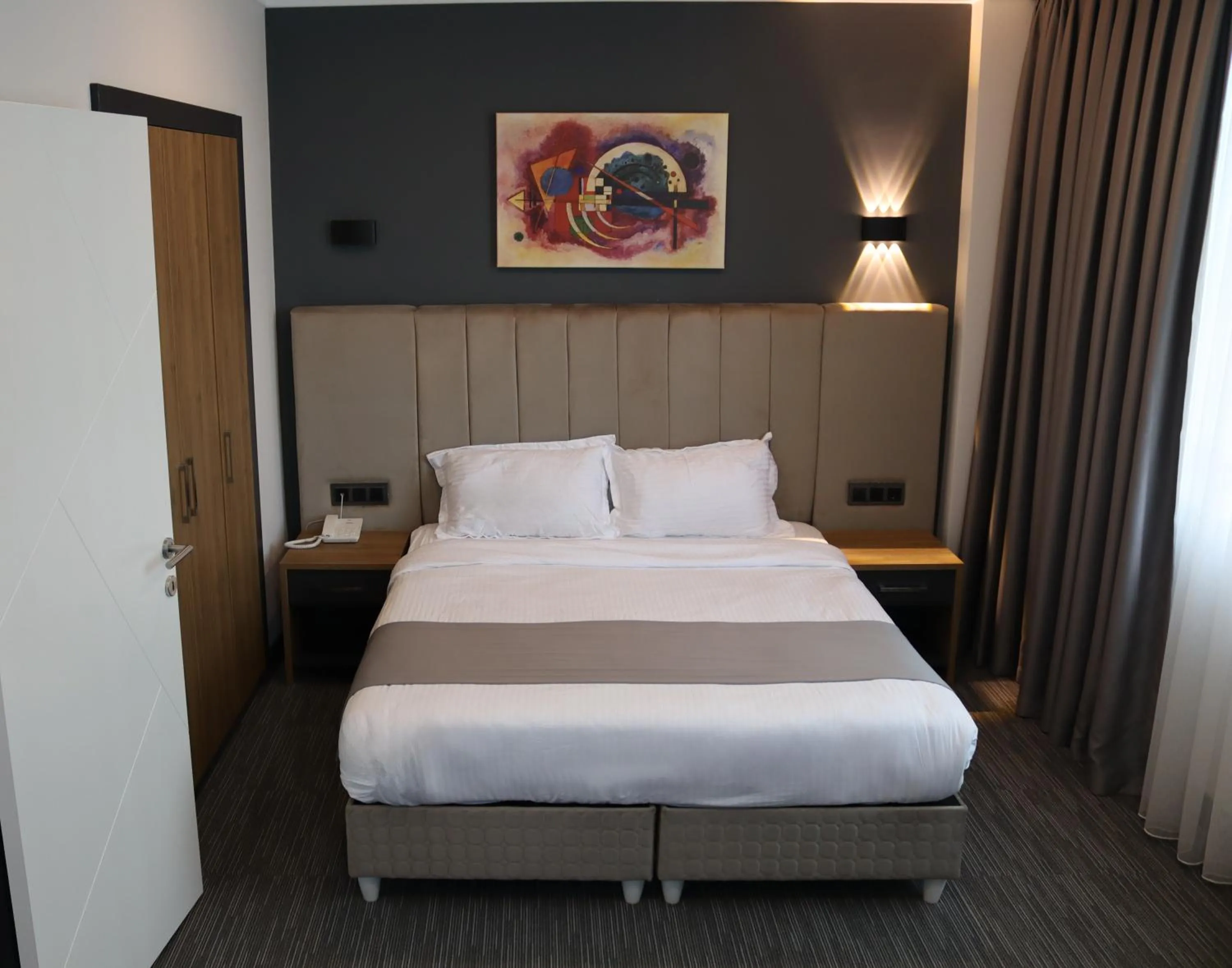 Bed in HOME PLUS Hotel