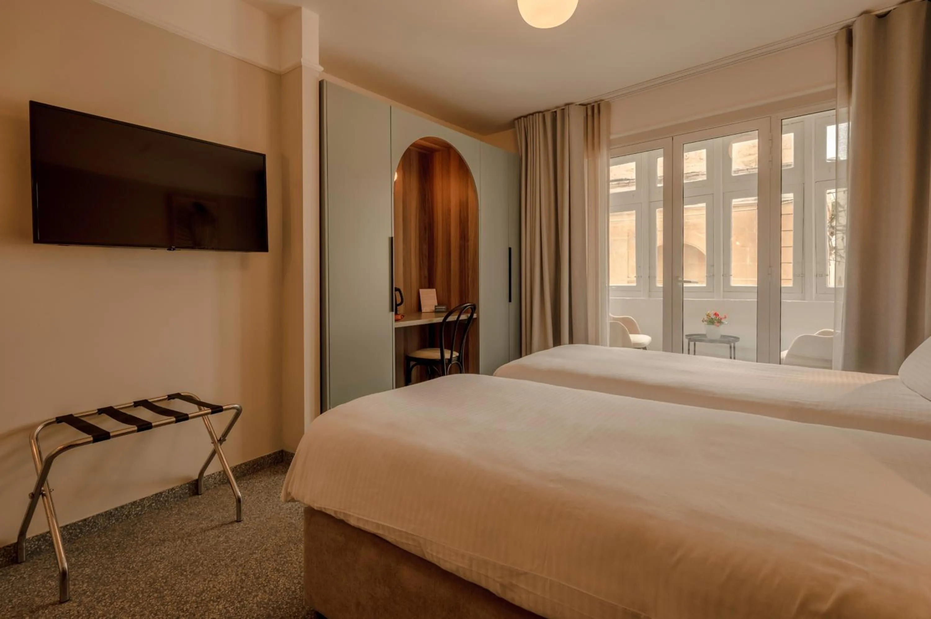 Bed in Maria Rosa Suites