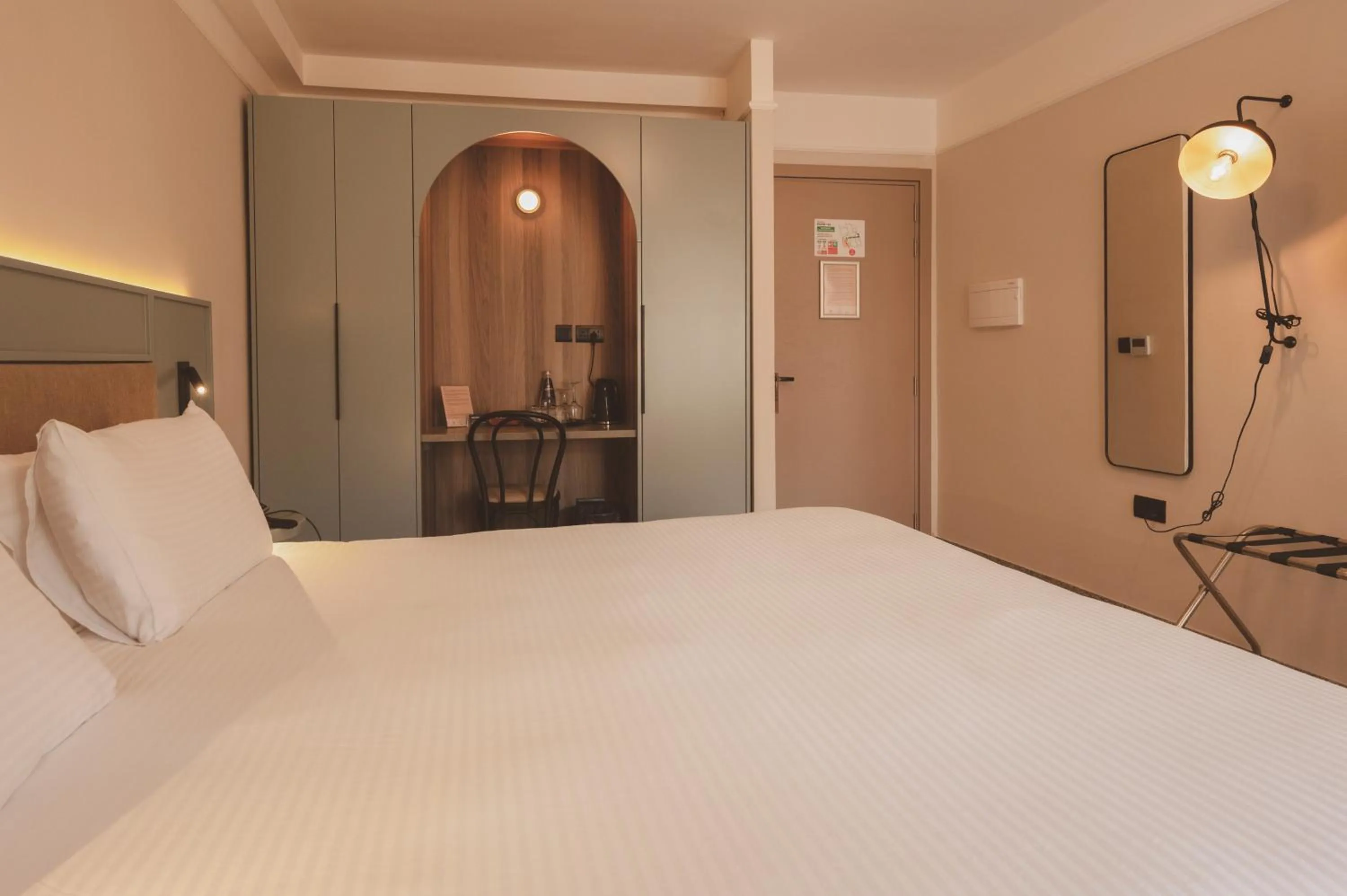 Bed in Maria Rosa Suites