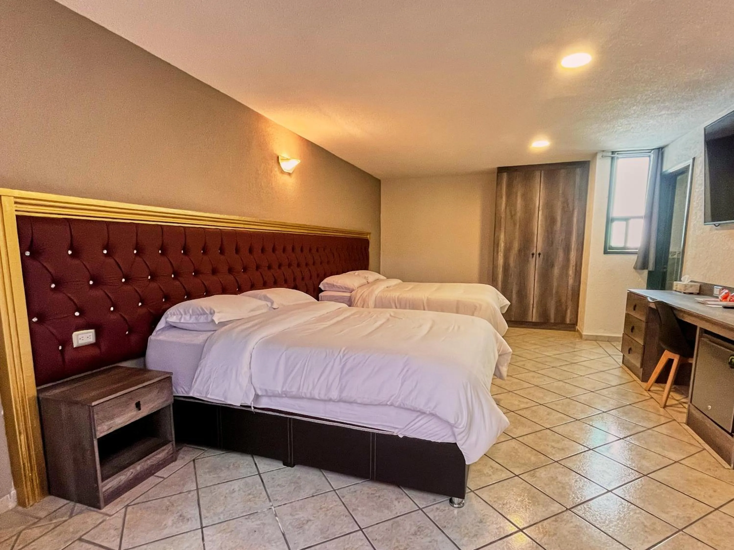 Bed in Hotel Casa Real Cholula