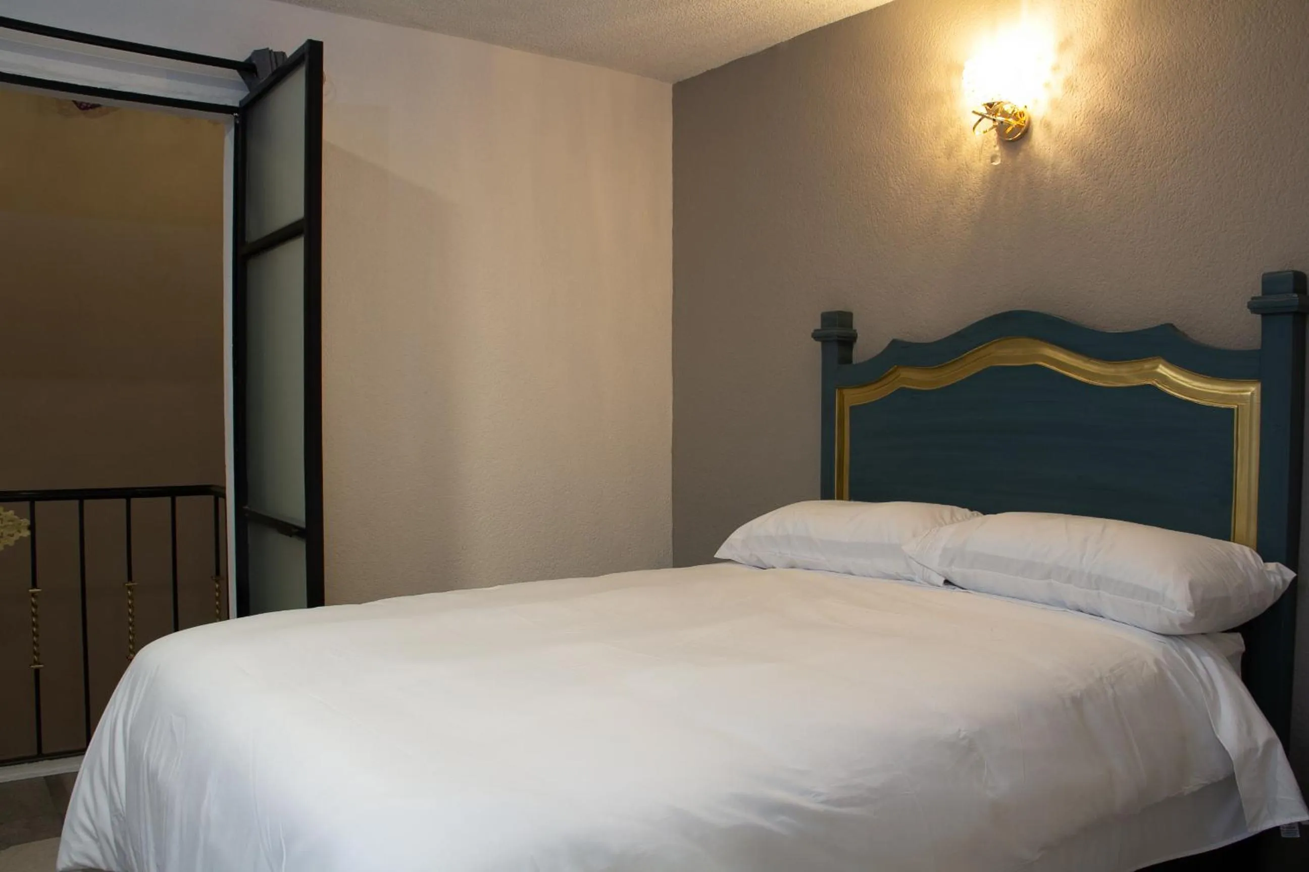 Bed in Hotel Casa Real Cholula