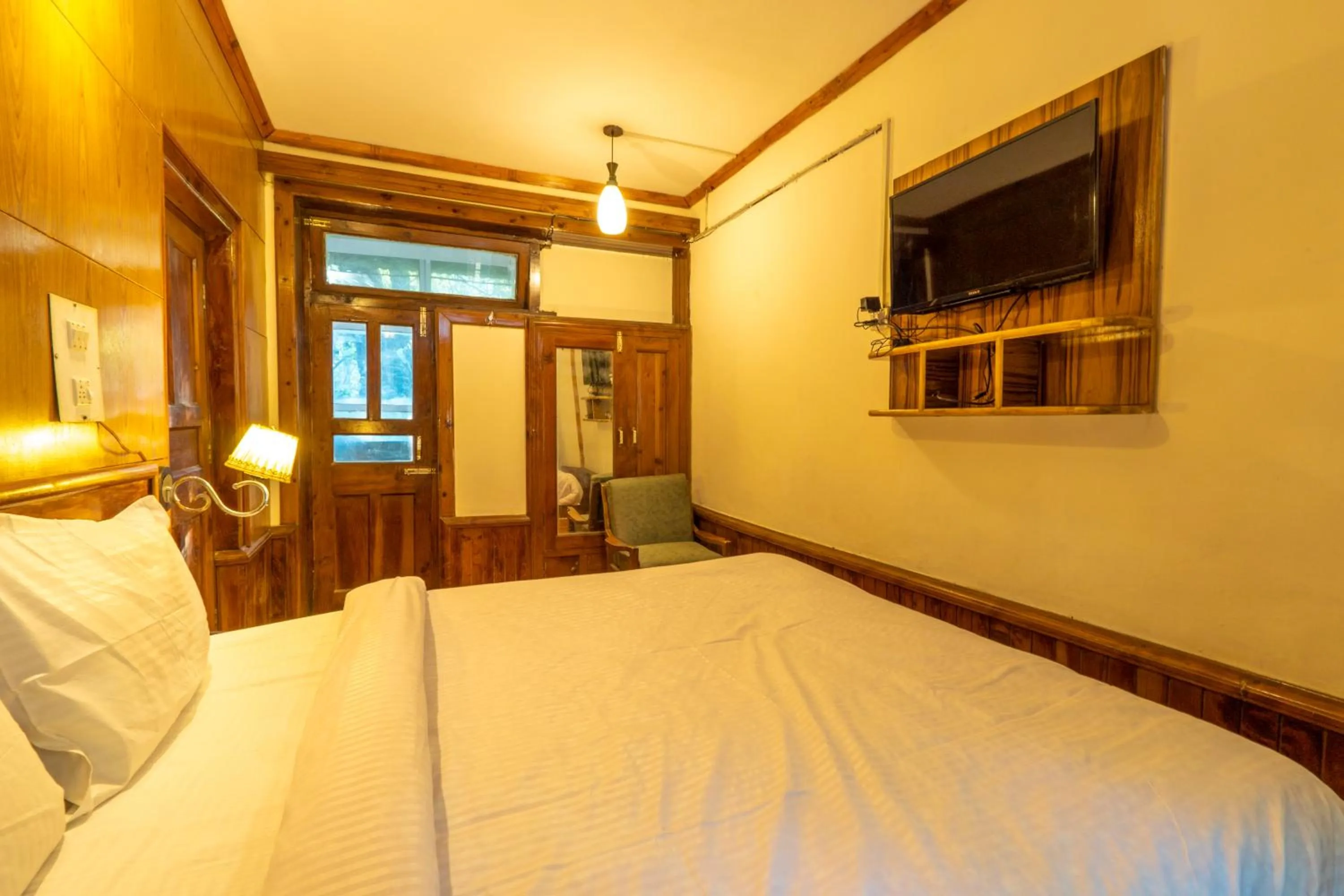 Bed in Holiday Home International -Vivaan Stays